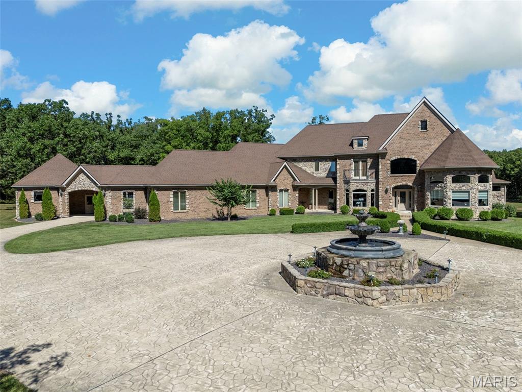 A Rare 30-Acre Estate with Private Lake and Unparalleled Elegance 
Experience a lifestyle of grandeur in this timeless 16,000+ square foot estate nestled within a private, rolling countryside. Designed for those who seek exclusivity, sophistication, and unmatched amenities, this residence is a true sanctuary.
A stately circular driveway with fountain welcomes you home, setting the tone for the refined elegance that awaits. Inside, the home features 5 expansive bedrooms and 7 luxurious bathrooms, each crafted with timeless finishes and meticulous attention to detail.
At the heart of the home lies a chef’s kitchen, fully equipped with professional-grade appliances, butlers pantry, and custom cabinetry—ideal for entertaining friends and family or on a grand scale. Expansive formal and casual living spaces flow seamlessly, with soaring ceilings, unparalleled views, and exquisite architectural detailing throughout.
Outdoors, the estate is equally impressive. The crown jewel of the property is the 4-acre stocked pond, a private retreat for fishing, kayaking, or simply enjoying the serene water views. With 30 acres of pristine land, it's sure to please the outdoor enthusiast of the family whether you're watching the bald eagles soar, the deer eat and play, or just cruising through the woods on a four wheeler, this property offers it all.
This estate is more than a home—it is a destination. A place where luxury meets tranquility, offering privacy and prestige in equal measure.
Additional information, interior photos and disclosures coming soon.