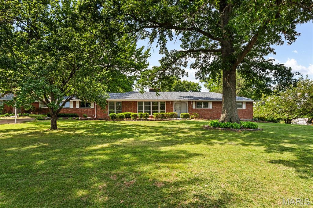 This spacious traditional ranch in the Black Oaks neighborhood has a lot to offer. The home features three bedrooms, two and a half updated baths, and a remodeled kitchen equipped with new appliances, including a dishwasher, fridge, and stove with a hood.

The thoughtfully designed floor plan includes a large living and dining room combo perfect for entertaining, as well as a den that shares a double-sided fireplace. The primary bedroom includes an en suite bathroom, with two additional main floor bedrooms and a dedicated laundry area. Outside, you will find a screened-in back porch and a two-car attached garage. Need room for a gym, extra family space or more bedrooms? The expansive basement is just waiting for you to finish it!

Extensive updates include:
- New roof in May
- Fresh paint throughout
- Updated bathrooms and kitchen with new fixtures, cabinets, and appliances
- New flooring 
- New retaining wall and landscaping
- new plumbing stacks and waterline
- Updated electrical system

All that is left to do is move in.
