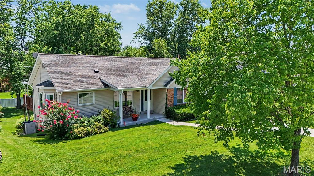 Welcome Home to this fantastic  Ranch Home in Unincorporated St. Charles County! 3 Bedrooms | 3 Full Bathrooms 
This ranch home offers everything you'd expect i a 3 bedroom ranch and so much more. This cozy home is perfectly situated in unincorporated St. Charles County and located within the highly sought-after Francis Howell School District. Combining tasteful  updates with an exceptional layout, this move-in-ready home offers the perfect blend of style, comfort, and convenience.Step inside to an inviting, open-concept main floor featuring seamless, durable luxury vinyl plank (LVP) flooring throughout.The Living  Room features soaring vaulted ceilings and large windows that flood the space with natural light. The kitchen boasts beautiful granite countertops, ample cabinetry, and tons of sunshine. The adjacent dining room flows effortlessly out to your private outdoor retreat. The covered deck is 15 x 15 and offers a true space for relaxation. The view from the deck is a fantastic expansive yard, whether you have a passion for gardening, want to build an outdoor play area, or love to host weekend BBQs, this expansive yard offers endless possibilities. primary bedroom's view of the backyard brings light and warmth. The primary bathroom was designed in a french country theme and offers extra space for a vanity. Fully Finished Lower Level walks-out and significantly expands your living space and is perfect for guests, teens, or an in-law suite, featuring a bedroom with egress window and large closet. The full bathroom with walk-in shower is right off the lower level recreation room. 
Completing the lower level is the laundry room with plenty of space for storage, then walk right into the tuck under garage.
Newer windows and a newer concrete driveway provide excellent curb appeal and peace of mind.This gem won’t last long on the market.