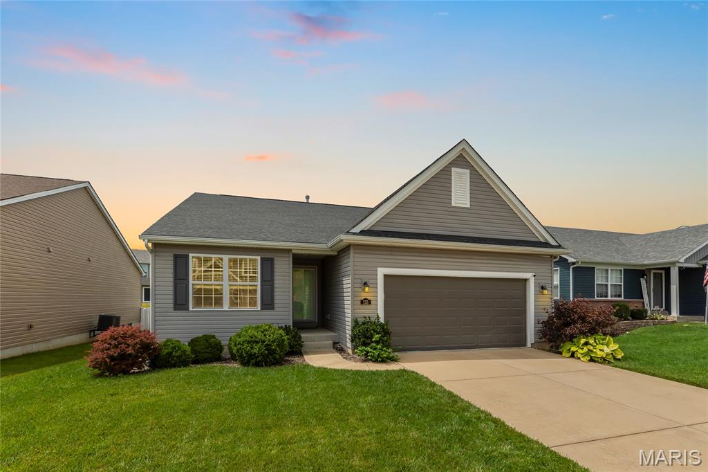 Stunning ranch-style home located in the popular subdivision of Villages at Huntleigh Ridge in Wentzville! This home boasts 3 bedrooms, 3 full bathrooms, and over 2,800 square feet of living space including the finished lower level.

The front door opens to the entry foyer with a coat closet and plank floors that flow throughout most of the main level. The living room features a vaulted ceiling, electric fireplace, stacked stone accent wall, and opens to the kitchen.

The updated kitchen boasts new quartz countertops (2022), tile backsplash, stainless steel appliances, new gas range stove & dishwasher (2023), breakfast bar, pantry, and dining area. 

The primary bedroom features a walk-in closet and luxurious bathroom. Two additional bedrooms, a full hall bathroom, mud room, and laundry room complete the main level. 

The finished lower level boasts a huge recreation room with a bar, new full bathroom (2023), a sleeping room with a barn door, and ample storage space. Other highlights include: 2 car garage, wrought iron spindles, new carpeting on main level (2022), new water filtration system (2023), and painted neutral colors throughout. 

Relax outside on the concrete back patio and enjoy the fully fenced in backyard. Location could not be better – close to major highways, restaurants, shops, schools, and walking distance to the subdivision pool, playground, and pavilion!