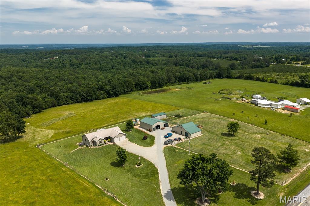 Welcome to your own private country retreat! This meticulously maintained 3-bedroom, 2-bath home sits on approximately 12 beautiful acres and offers the perfect combination of comfort, functionality, recreation, and rural charm. Whether you're looking for a full-time residence, hobby farm, horse property, hunting retreat, or simply a peaceful place to enjoy country living, this property delivers exceptional versatility and value.
The home has been lovingly cared for and showcases pride of ownership throughout. The spacious floor plan provides comfortable living areas, generous bedroom sizes, and a welcoming atmosphere that immediately feels like home. An attached two-car garage offers convenient access and additional storage space for vehicles, tools, and outdoor equipment.
One of the standout features of the property is the full walk-out basement, which significantly expands the home's potential. The basement is already plumbed for an additional bathroom, making future finishing projects more convenient and cost-effective. Whether you envision additional bedrooms, a family room, recreation area, home gym, office space, or guest quarters, the basement provides an excellent opportunity to add substantial living space and value. The basement also includes a dedicated safe room, offering additional security and peace of mind.
Outside, the property truly shines. Currently utilized as a mini farm, the acreage is well-suited for a variety of agricultural and recreational uses. The land provides plenty of room for horses, livestock, gardening, hay production, hobby farming, or simply enjoying wide-open spaces and beautiful country views. A barn on the property offers flexibility for livestock, equipment storage, feed, or agricultural operations.
In addition to the barn, you'll find a large insulated outbuilding complete with electricity and an attached lean-to. This impressive structure provides endless possibilities and could serve as a workshop, equipment storage facility, hobby space, business operation, woodworking shop, automotive workspace, or secure storage for boats, tractors, side-by-sides, campers, and other recreational equipment. The insulated construction and electrical service make this building a valuable asset that is difficult and expensive to replace.
Outdoor enthusiasts will appreciate everything this property has to offer. The acreage provides excellent opportunities for hunting and wildlife observation, with abundant deer and turkey frequently seen throughout the property. The combination of open areas, natural cover, and rural surroundings creates ideal wildlife habitat and makes this an attractive recreational property. Whether you enjoy hunting, hiking, ATV riding, nature photography, or simply spending time outdoors, this property offers endless opportunities right outside your back door.
The setting provides the privacy and tranquility that many buyers are searching for while still offering convenient access to nearby communities. Located approximately 30 minutes from Jackson and only about 15 minutes from Fredericktown, you'll enjoy easy access to shopping, dining, healthcare, schools, and other essential services while maintaining the peaceful lifestyle that only country living can provide.
Properties offering this combination of a well-maintained home, usable acreage, quality outbuildings, hunting opportunities, agricultural potential, and convenient location are becoming increasingly difficult to find. Whether your dream is raising animals, owning horses, operating a hobby farm, enjoying recreational land, or simply escaping the hustle and bustle of city life, this exceptional property is ready to make that dream a reality.
Don't miss this rare opportunity to own a versatile country property that offers room to grow, space to explore, and countless possibilities for years to come. Schedule your private showing today and discover everything this remarkable property has to offer.