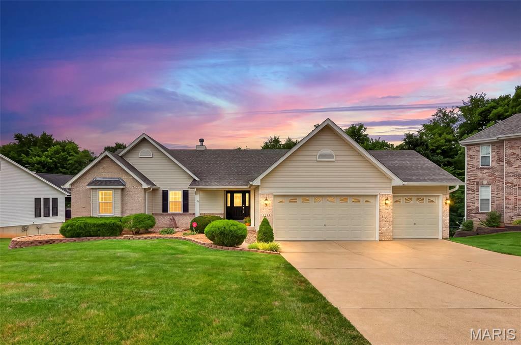 **OPEN SATURDAY 11AM - 1PM & OPEN SUNDAY 1-3PM**
Nestled in the desirable Benzel Meadows community and served by the sought-after Windsor School District, this beautifully maintained atrium ranch offers the perfect blend of comfort, style, and exceptional entertaining space. Backing to mature trees, you'll enjoy peaceful views, relaxing visits from neighborhood deer, and a private setting that feels like a retreat.

Step through the welcoming foyer and be captivated by soaring two-story atrium windows that flood the home with natural light. Gorgeous hardwood floors lead into the spacious great room, where a cozy gas fireplace creates the perfect gathering space. The open-concept design seamlessly connects the great room, breakfast area, and well-appointed kitchen, making everyday living and entertaining effortless. Step outside to the low maintenance, composite deck and enjoy your morning coffee overlooking the tree lined backyard. Enjoy holiday gatherings and memories made in the formal dining room.

The spacious primary suite is a relaxing escape featuring a walk-in closet and a luxurious ensuite bath with dual vanities, a separate shower, and a corner soaker tub perfectly positioned to take in the tranquil wooded views. Two additional bedrooms,  full hall bath, half bath and laundry room complete the main level. Enjoy the oversized three-car garage, adds everyday convenience.

The finished walk-out lower level is truly an entertainer's dream. The included pool table serves as the centerpiece of the expansive recreation room, complete with ceramic tile flooring featuring decorative inlay. A built-in wet bar with illuminated glass-front cabinetry creates the perfect setting for game nights, celebrations, or hosting friends. You'll also find a spacious 4th  bedroom, a third full bath, and abundant unfinished storage space.

Step outside to your patio and view of trees and privacy.

If you've been searching for a move-in ready home with an open floor plan, beautiful wooded views, and incredible entertaining spaces, this one checks every box.