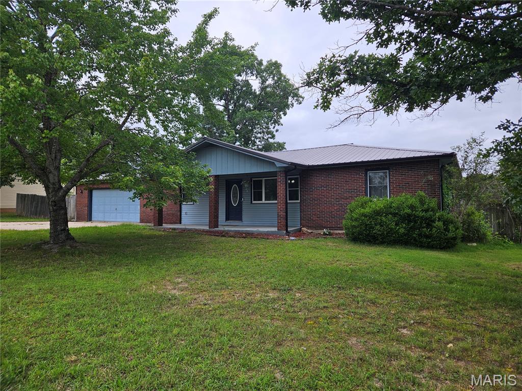 Located just minutes from Fort Leonard Wood, this well-maintained 3-bedroom, 2-bath home combines comfort, space, and a functional layout. The oversized living room serves as the heart of the home, offering plenty of room to gather, relax, and entertain. A bright sunroom extends the living space and provides the perfect spot to enjoy your morning coffee or unwind while overlooking the backyard.

The open flow between the living and dining areas creates a welcoming atmosphere, while the split-bedroom floor plan offers added privacy by separating the primary suite from the secondary bedrooms. Outside, the privacy-fenced backyard provides a great setting for pets, outdoor activities, or simply enjoying your own private retreat. A spacious two-car garage adds convenience and extra storage.

Whether you're searching for your next home or a smart investment opportunity near Fort Leonard Wood, this property offers a combination of location, functionality, and charm that's hard to beat.