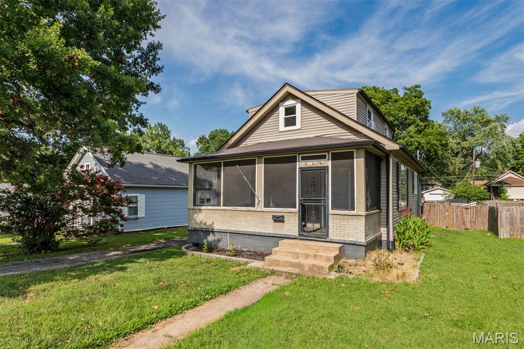 Welcome home to this adorable story and a half home featuring 3 bedrooms and 2 bathrooms with a screened front porch. The spacious living room is open and bright from the natural light pouring through the surrounding windows. The eat-in kitchen is complete with plenty of cabinet and counter space for all your storage needs and a nice nook area for a table and chair. Just past the kitchen a barn door slides open to a sunroom that is perfect for a small office/den or sitting room. The master bedroom is located on the main level with a large closet, built in desk area and private master bathroom with a nice vanity and tub/shower combo. Completing the main level is a convenient main floor laundry room that leads out to the back yard. Upper level you will find 2 additional nicely-sized bedrooms with large closet spaces and a half bathroom. The walk-out basement is unfinished offering tons of storage space. Onto the exterior of the home you will find a long driveway leading back to a 1 car garage and a fenced backyard perfect for relaxing or entertaining guests. Recent updates to home include new front door, ceiling fans, upper level windows, kitchen windows and insulation/drywall & carpet in upper level bedroom. Be sure to make your appointment today to come check out this great home located close to favorable restaurants and shopping centers.