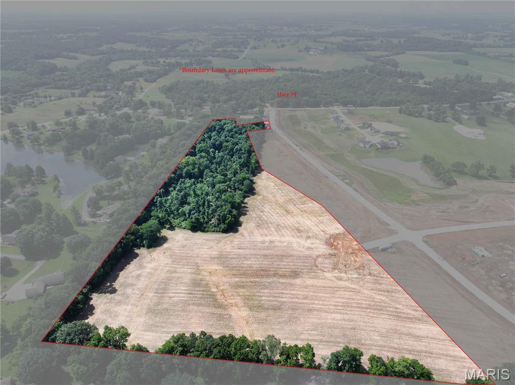 NEW LISTING! Discover the perfect blend of country living and convenience with this 23.29 +/- acre tract located just outside of Jackson, Missouri, off Highway 34. Featuring concrete street access, electric and water available, and multiple flat building sites, this property offers an excellent opportunity to build your dream home or invest in future development. The sellers are willing to divide the property, subject to their approval. Enjoy navigable trails winding through the wooded acreage, providing opportunities for recreation and nature exploration. Located in the desirable Kinder Farms Subdivision, this property is situated in a growing area and is approximately 3 miles +/- from Jackson Schools. Don't miss this rare opportunity to own acreage with both privacy and accessibility.