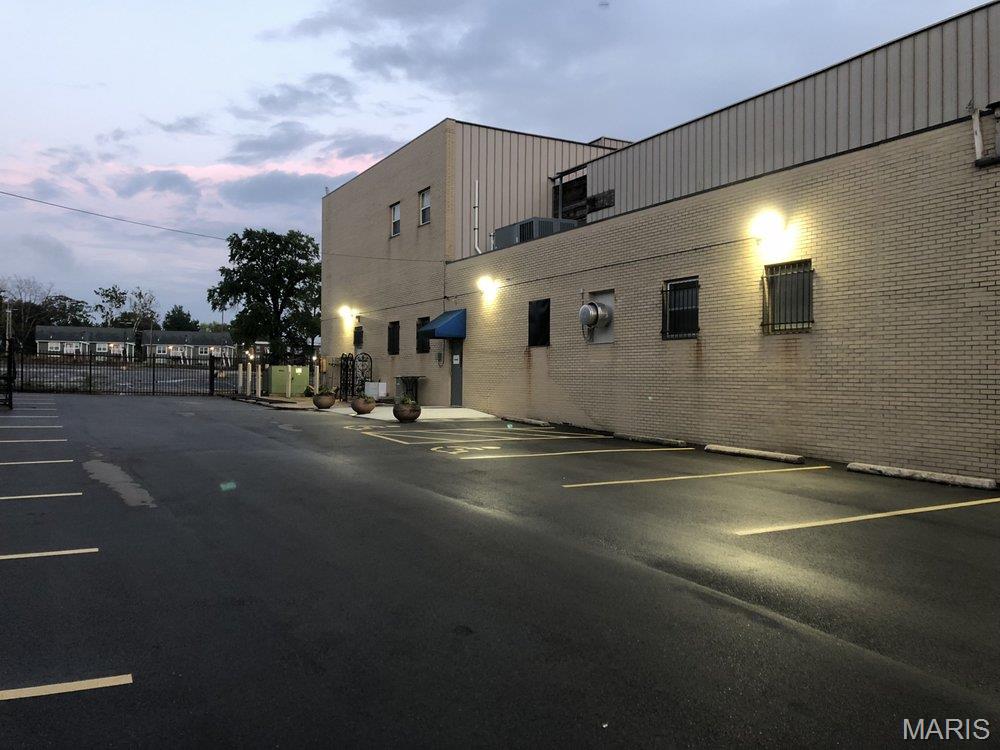 Prime Commercial Opportunity in the Heart of St. Louis locally known as the Delmar Divine! Position your business for success with this highly visible 10,081-square-foot commercial building situated on nearly one acre (0.91± acres) in one of St. Louis' most strategic growth corridors. Located just minutes from the Central West End, Delmar Loop, Forest Park, Washington University, and major interstate access, this versatile property offers exceptional opportunities for owner-users, investors, nonprofits, educational facilities, religious organizations, or redevelopment projects. Constructed of durable brick and designed for flexibility, the property features expansive open floor areas, a working commercial kitchen, concrete flooring, central HVAC, public utilities, security systems, accessible common areas, and a gated private parking lot with abundant off-street parking. The secure site includes an electric gate, building security. The building's adaptable layout supports a wide range of uses including professional offices, retail, wholesale operations, warehouse space, community organizations, educational facilities, recreation centers, event venues, places of worship, medical services, or mixed commercial uses. With nearly an acre of land, significant parking capacity, and a location surrounded by ongoing investment and redevelopment, this property offers long-term value appreciation potential. Property is being sold As-Is. Shown by appointment only to financing approved buyers with listing agent present.