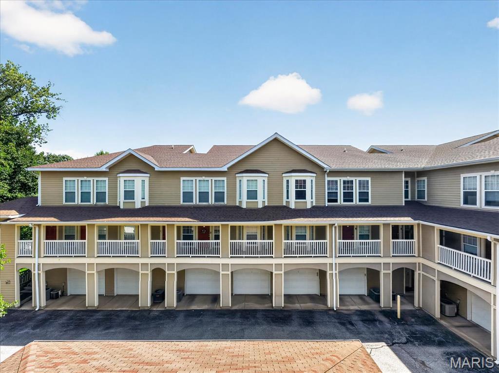 Discover the perfect blend of comfort, style, and convenience in this beautifully maintained upper-level condo located in the highly sought-after Webster Groves School District. Thoughtfully designed with an open-concept layout, this 2-bedroom, 2-bath home offers an inviting atmosphere filled with natural light, warm finishes, and timeless design throughout. The spacious living room welcomes you with elegant tray ceilings, custom built-ins, and seamless flow into the dining area and beautifully appointed kitchen, creating the perfect setting for both everyday living and entertaining. The kitchen features granite countertops, custom cabinetry, stainless steel appliances, a center island with a breakfast bar, and a generous pantry, offering both style and functionality. Escape to the spacious primary suite, complete with a cozy electric fireplace and an oversized walk-in closet. A generously sized second bedroom and full bath provide the ideal setup for guests, a home office, or additional living space. Additional highlights include in-unit laundry, a built-in desk perfect for working from home, wired surround sound, crown molding, and a detached garage parking space. Ideally situated just minutes from Webster Groves, Kirkwood, Brentwood, Clayton, shopping, restaurants, parks, and major highways, this move-in-ready condo offers the perfect combination of low-maintenance living, thoughtful design, and an unbeatable central location.