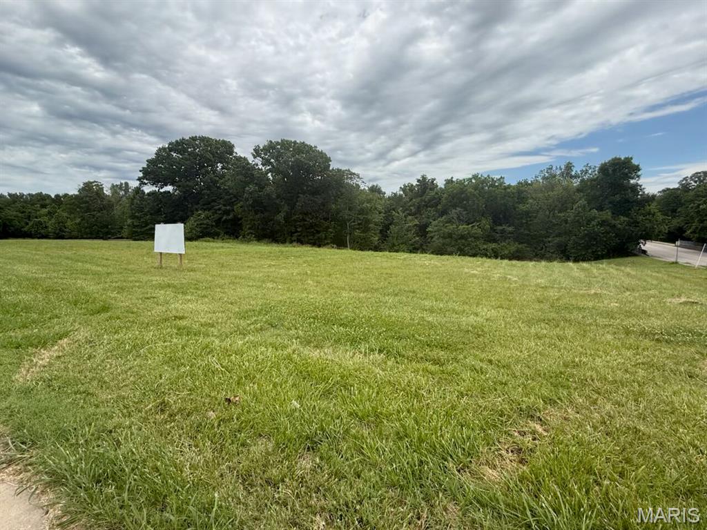 PERFECT LOCATION FOR COMMERCIAL DEVELOPMENT! BUY the full 7 plus acres OR the Sellers have a proposed plan to divide into three great commercial lots to better suit smaller commercial needs. PLEASE SEE the attached proposed plat with three fantastic commercial lot options.  This acreage along Mount Auburn Road would provide your business with unbelievable visibility! It has excellent road frontage and traffic count, and would be perfect for professional offices, retail, or even a well-placed convenience store. Zoning is currently C-1 but it can potentially be re-zoned to residential multi-family.
