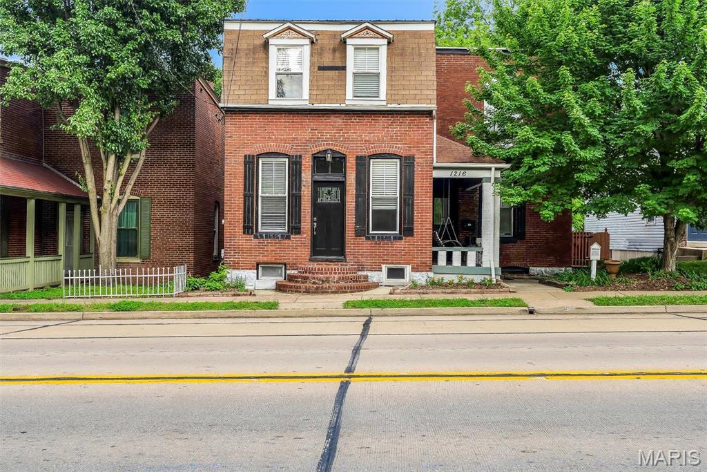 Own a piece of St. Charles history with this beautifully updated historic home located in the heart of the desirable Frenchtown Historic District. Originally built in 1890, this spacious 3-bedroom, 3-bath home blends timeless character with modern updates throughout. Features include high-efficiency HVAC, updated flooring, and over 2,300 sq ft of living space.

Perched high on the hill, this property offers beautiful views overlooking the river and provides a front-row seat to the Fourth of July fireworks display — all from the comfort of your own home.

The updated kitchen offers modern cabinetry, stainless steel appliances, and a fully equipped Butler’s pantry, perfect for entertaining and additional storage. Step outside to enjoy multiple outdoor living spaces, including a deck off the kitchen and an additional deck from the walkout basement surrounding the pool — ideal for relaxing or hosting guests.

One of the standout features is the oversized detached garage with an additional 625 sq ft of finished living space, offering endless possibilities as a studio, home office, guest suite, man cave, or potential apartment conversion.

Located just minutes from Historic Main Street, St. Charles, shopping, restaurants, riverfront attractions, and local events, this home combines historic character, flexible living space, and modern convenience in one unique property. Schedule your private showing today!
 *Some of these photos have been virtually enhanced and staged. *