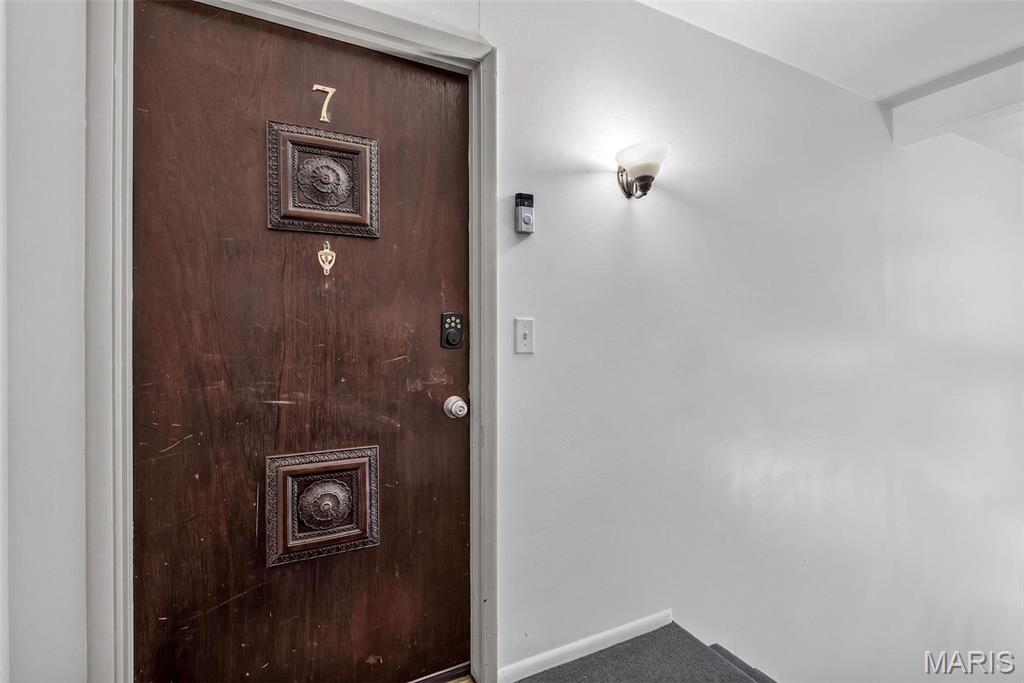 Location, lifestyle, and one-of-a-kind features — this rarely available upper-level end unit checks every box, and then some! Tucked just off Gravois in the highly desirable Lindbergh School District, this 2-bedroom, 1-bath condo offers just under 1000 square feet of bright, comfortable living space that has been thoughtfully updated and meticulously cared for by its current owner. And here's something you won't find anywhere else in the complex: this is the ONLY unit with an attic fan — a rare bonus that keeps things cool and comfortable all summer long while keeping those utility bills in check. New HVAC with air scrubber and New Roof! 
Your private entry foyer, complete with a solid, secure front door, leads you upstairs to a wonderfully open floor plan. The spacious living room flows effortlessly into the kitchen and dining area, where you'll find sleek black appliances, easy-care ceramic tile flooring, and a sunny breakfast nook. From there, step through the atrium door onto your covered balcony — the perfect spot for your morning coffee, an evening glass of wine, or simply watching the seasons change from your corner-unit perch.
Both bedrooms are generously sized. Storage? This condo has it in spades. Between the walk-in closet, his-and-hers closets, and closets seemingly around every corner, you'll never wonder where to put things. And it doesn't stop there — a separate common building houses the shared laundry facility along with a spacious additional storage area dedicated to this unit. There is also a laundry facility in the building that is shared with a wonderful neighbor. 
New doors throughout give the home a fresh, polished feel, and the pride of ownership here is evident in every detail. With quick access to shopping, dining, and major routes, plus the award-winning Lindbergh schools, this is the kind of opportunity that doesn't come around often. Homes in this complex are rarely available for ownership — and one this well-loved, with features no other unit can claim? Don't wait. Schedule your private showing today and come see why this one feels like home!