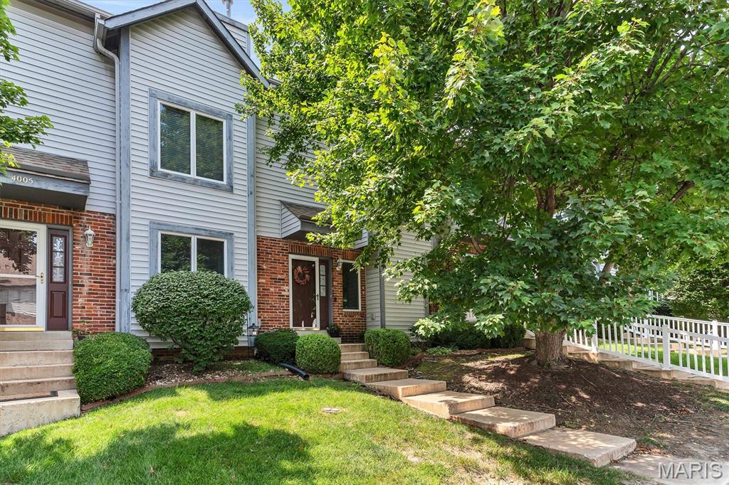 Incredible Townhome with TWO PRIMARY SUITES AND BATHS!  Newer Flooring and Lighting!  Open floorplan.  Large greatroom with gas fireplace and mantel.  Half Bath on the main level.  Main Floor Laundry.  Kitchen has white cabinets, stainless steel appliances, built in microwave, counter top space for prepping.  Refrigerator, washer, and dryer are negotiable.  Large dining room with french door to the maintenance free deck. Additional electric awning to cover the deck.  Walk out lower level, two car garage, and large storage room.  Home has been freshly painted.  Enjoy the pool, clubhouse, and low hoa fees that cover exterior insurance/mainteance and trash removal.   Great location and great price.  Come check it out.