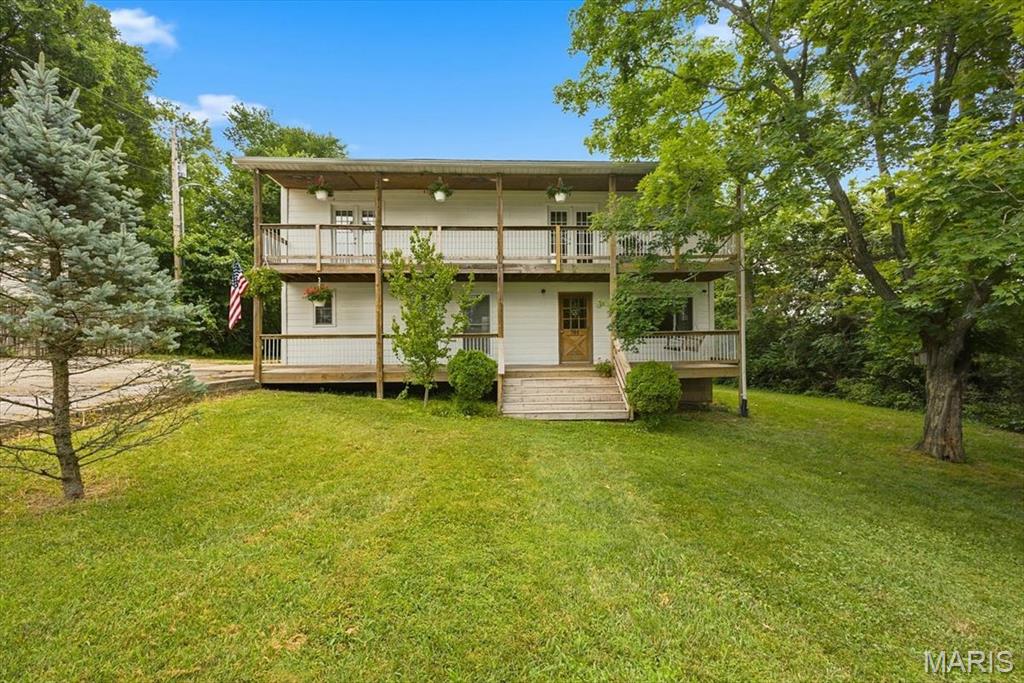 Unique 1950's era farmhouse property on over an acre within walking/biking distance to downtown Eureka! This is a MUST see if you're looking for room to roam while staying in the Rockwood School District. Curb appeal impresses with a massive front yard & winding driveway. Multi-level covered deck provides a picture perfect setting for those summer nights. Walk inside to original solid wood floors, recessed lighting, extensive windows & bright & neutral colors. Country style kitchen includes large center island w/butcher block counters, white cabinets, pot filler over the stove & custom back splash. Main level includes an updated full bath, laundry room & office space. Walk upstairs to a MB suite, renovated master bath w/custom shower enclosure & dual vanities.  2 add BR's on the 2nd level share a 2nd full bath. Out back is a recently replaced ground level deck, MASSIVE & flat backyard & barn w/electric already connected. No HOA, close proximity to the Timbers Rec Center, Downtown Eureka, Soccer fields, Baseball fields and so on!  Septic system recently replaced!