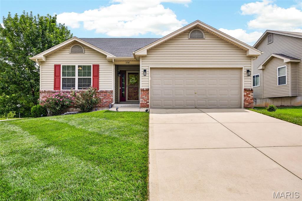 Why wait to build when this move-in-ready home has it all? This 3-bedroom, 2-bath home in the highly sought-after Wentzville School District features vaulted ceilings that create an open and airy feel throughout the main living area. The kitchen offers granite countertops and overlooks a bright breakfast area highlighted by a charming bay window. Enjoy the convenience of main-floor laundry, new flooring, and a finished basement that provides additional living and entertaining space. Outside, you'll find a mostly flat backyard with a cozy patio, perfect for relaxing or hosting guests, along with a 2-car garage. Conveniently located near Indian Camp Creek, this home combines comfort, style, and location. Don't miss your chance to make it yours!