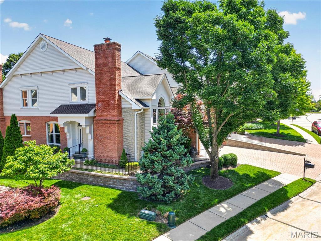 Meticulously maintained and beautifully appointed, this stunning 3-bedroom, 3.5-bath villa offers an exceptional blend of elegance, comfort, and low-maintenance living. Soaring ceilings, hardwood floors throughout, and abundant natural light create a warm and inviting atmosphere from the moment you enter. The light-filled kitchen opens seamlessly to the inviting hearth room with a second gas fireplace and a wall of windows overlooking the deck and private backyard—perfect for everyday living and entertaining. An elegant dining room showcases beautiful moldings, while the stunning living room offers custom built-ins, a gas fireplace, vaulted ceiling, and dramatic floor-to-ceiling Palladian windows. The spacious main-floor primary suite features walk-in closets and a luxurious en-suite bath with double vanities, a Jacuzzi tub, and a separate shower. Upstairs, you'll find two generously sized en-suite bedrooms, each with walk-in closets, along with a spacious bonus room featuring a huge cedar closet, plus a loft that overlooks the living room below. Additional highlights include a main-floor laundry room, powder room, attached 2-car garage, and an abundance of storage in the lower level. Enjoy carefree living with a low HOA of just $315 per month, all in a convenient location close to shopping, dining, and everyday amenities.