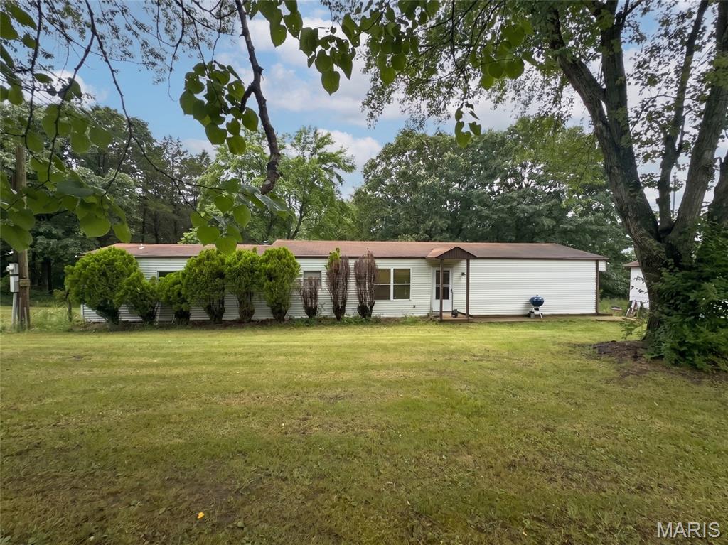 Discover the potential of this 3-bedroom, 2-bath ranch home situated on approximately 1.46 acres in a peaceful setting. Offering 1,688 sq. ft. of living space, this home features newer plank flooring throughout most of the interior, creating an inviting feel from the moment you walk in. The kitchen is ready for your personal touch and provides a great opportunity to create the space you've always envisioned.

Enjoy the privacy and possibilities that come with a large lot, complete with a detached garage and plenty of room to make the property your own. Buyer to verify all information, including schools, taxes, and square footage.