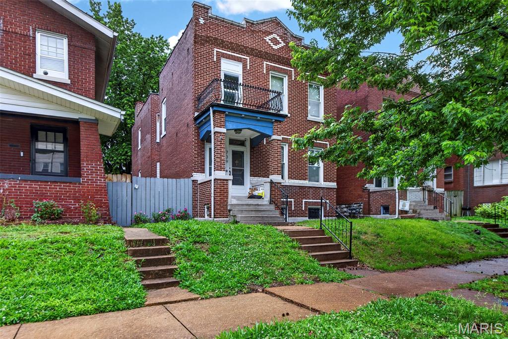 Unlock the potential of this spacious two-family duplex in a highly desirable neighborhood. Offering nearly 2,500 sq. ft. of living space, this property is ideal for investors seeking dual rental income or owner-occupants looking to offset housing costs. Enjoy close proximity to parks, shopping, and easy access to Hwy 55, adding appeal for tenants and future buyers alike.

Each unit features oversized crown molding, decorative fireplaces, and built-in bookcases. The second-floor unit offers two bedrooms, an updated kitchen with granite counters, wood flooring, and contemporary lighting. The first-floor unit includes an oversized one-bedroom layout with similar finishes, creating a comfortable and inviting living space. A fenced backyard and two-car garage add even more value.

Whether expanding your investment portfolio or exploring an income-generating home, this duplex presents an excellent opportunity.