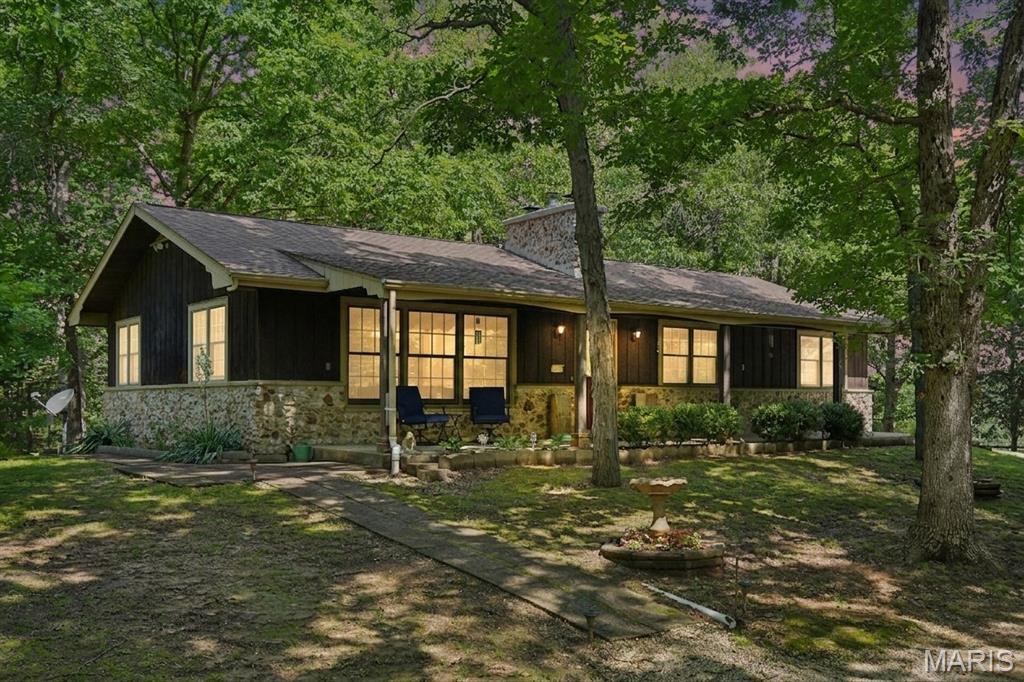 Welcome to your own slice of country paradise on 42.16 +/- acres.  This cherished family farm features a cozy 3-BRM 2 1/2 BTH ranch with a covered front porch, a peaceful back deck for wildlife watching, and a charming enclose porch with A/C.  Inside, you'll find a beautiful stone  wood burning fireplace with a insert, oak-cabinetry  kitchen,  and a full basement complete with a country kitchen with a wood burning cook stove ideal for summer canning, gatherings, and year- round comfort. Also featured in the basement is a wood burning fireplace. The land is gorgeous and usable, with multiple outbuildings with most of them having electric.   A brand new septic system with a new fenced in lagoon, (2026) and a fresh survey (2026).  A home generator for a peace of mind to keep a few items running if need be.   This is a rare opportunity to own a well-loved long held heritage family farm with endless potential. FARM IS BEING SOLD AS IS.  SIBBLINGS HAVE DISCLOSED ALL KNOWN  INFO ON THE SELLERS DISCLOSURE FROM ALL DOCUMENTS THAT HAVE BEEN KEPT IN A FILE.  BUYERS MAY DO THEIR INSPECTIONS FOR THEIR OWN KNOWLEDGE. PLEASE US A SPECIAL SALES CONTRACT.