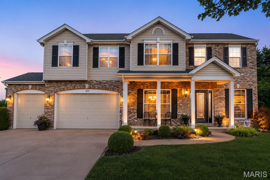 This meticulously maintained lovely home is nestled on a cul-de-sac.  Upon arriving you will notice the manicured lawn and picturesque landscaping featuring ambiently placed landscape lighting, irrigation for both the front and backyards.  The backyard is a paradise of its own backing to lush trees and having a large stamped concrete patio to sit and take in the quintessential view. The patio extends from the walk-out basement under the maintenance free deck–large enough to add your own porch swing, hammock or generous sized patio furniture.  Other elements in addition to thoughtful landscaping include a Japanese koi fish pond– creating an intensely peaceful, meditative, experience. "Little fishies” are ready for their new owners–top all of this off with a 3 light vintage style park lantern, the large lighted tree and you have yourself visual harmony that creates an immediate feeling of relaxation.

If you can think of the details in the backyard, you can only imagine the details put into the interior! Before we begin, you should know that every single detail added to this home was done for the love of the home…so let’s begin with the covered front porch and let’s walk-in through the newer decorative, leaded front door w/sidelights. Stepping in your eyes will be drawn to a home filled with ornate trim & moldings, hand–scraped tasteful + timeless/versatile hardwood flooring and an entryway that is anchored by a beautifully refined solid oak staircase, and accented by ornate black spindles. The 9ft ceilings on this main floor add even more architectural grandeur.  

The updated kitchen is just beautiful featuring 42" perfectly "greige" neutral cabinets that are a perfect blend of gray and beige to go with any color scheme! The cabinet's elegance stands on its own with their crown molding, soft close + pull-out trays, undermount cabinet lighting and topped off with glass-tile backsplash, granite counters+stainless steel appliances. Center island offers additional storage + seating. The butler’s pantry is perfect “pouring area” for a dry bar or coffee bar! Choose to enjoy your meals in the eat-in kitchen with a bay window (adorned with decorative moldings) that takes in your green space and invites you to come out to the beautiful deck or enjoy it in your elegant formal dining area! Your kitchen area flows directly into the large family room with yet another bay window (5 pane) to take in the view! The family room has floor to ceiling custom built-ins w/lighting, a gas fireplace with neutral brick+solid wood mantel. The home office is enclosed with French doors with upscale molding as well!
There’s a large main floor laundry/mudroom with a nicer laundry sink + built-in cabinets and folding station! The powder room is updated and has a very nice vessel sink! 
The upper level features 4 bedrooms and 3 full bathrooms!  The LOFT area is great for a second living area, additional home office or gaming room! The expansive primary bedroom has soaring vaulted ceilings, a large walk-in closet, ensuite-2 sinks, shower + a jetted tub! Bedrooms 3 & 4th have their own Jack ‘n Jill bathroom. Bedroom #2 can take full use of the 3rd hallway bathroom that has also been refreshed!   

Finished lower level ready for entertaining featuring many great spaces & aspects! Family room has a gas ventless fireplace, WET-BAR with mini fridge+mounted Bar TV! Game room or seating/dining! Workout area for home gym! Half Bath and a large storage room w/built-in shelving. Might I add that the lower level is a walk-out with double doors that both open to enjoy that backyard scenic experience. 

Great location walk to Rockwood Summit High School & Middle School.  Hear the band practice on occasion and the energy from football games! Quick access Highways 141, 44 & 30! Impeccably maintained – Roof (2021) DUAL HVAC UNITS (2021/2015) WaterHtr~5 yrs old. 3 car garage insulated
walls+garage door. Interior pics up Wed & SHOWINGS start SAT 6/20 9am
