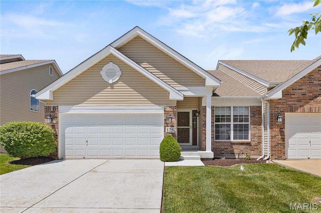 Enjoy carefree living in this beautifully maintained end-unit ranch villa.
Step inside to an open and inviting floor plan featuring a separate dining room and a spacious living room with vaulted ceilings.  The kitchen features 42-inch cabinetry, a large walk-in pantry, breakfast bar, and attractive tile backsplash. The adjoining breakfast room provides the perfect spot for morning coffee and opens to a large covered deck, allowing you to enjoy the outdoors in comfort.  The primary bedroom featuring two closets and private bath with an oversized marble shower and built-in seat. A second bedroom and an additional full bathroom provide comfortable accommodations for family members or overnight guests. The walkout lower level includes a bathroom rough-in and sliding doors leading to concrete stamped patio.
