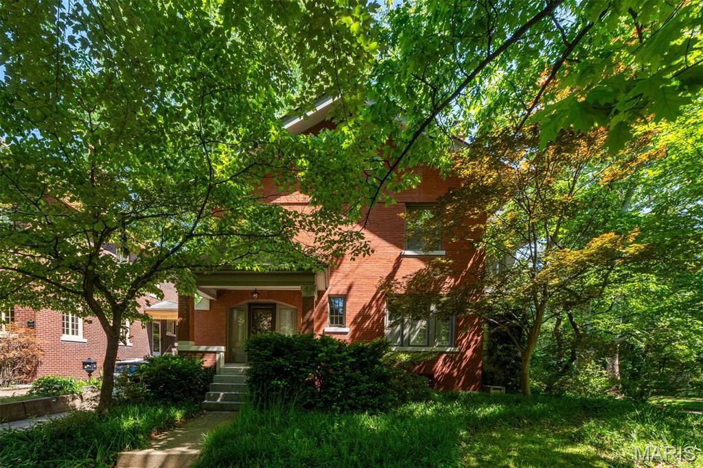 Directly across from Missouri Botanical Garden and just steps from Tower Grove Park, this is the home — and location — you’ve been waiting for. Framed by Japanese Maple, Redbud, and Dogwood trees and rhododendron and azaleas, this home invites you in from the moment you see it. The main floor offers the perfect blend of character and functionality, featuring an updated kitchen, family room, dining room, and a versatile bonus space ideal for a home office, playroom, or additional living area. On the second floor, you’ll find three generously sized bedrooms, including one ensuite, along with a sun porch and an additional full bathroom, with ample space and beautiful original features. The third-floor primary suite is a true retreat. Thoughtfully designed by the current homeowners, this private oasis includes a spacious bedroom, full bathroom, walk-in closet, and sitting room. The showpiece is the private balcony overlooking the Botanical Garden — the perfect place to unwind while enjoying evenings filled with music from the Whitaker Music Festival. Outside, a large patio, backyard, and tuck-under garage complete this exceptional home. Rarely do homes on this street come to the public market. Will you be the next lucky resident?