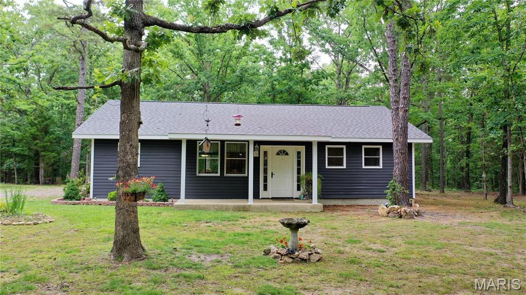 Tucked away at the end of a private drive and surrounded by pine and oak trees, this 21-acre property offers the privacy and peaceful country lifestyle you've been searching for. Built in 2021, the 1,260-square-foot home features 2 bedrooms and 1 bath, combining modern construction with rustic charm. This property is well-equipped for hobby farming, homesteading, small-scale agricultural operations, and just fun recreational use. A new barn provides space for a horse and hay storage, while the chicken coop, greenhouse, high tunnel, and sheds create opportunities for gardening and livestock. There is a stocked pond at the front featuring bluegill, red ear, and channel catfish, along with a wildlife pond tucked away toward the back of the property, perfect for deer and turkey. A brand-new well, 200-amp electric service, and a commercial-style refrigeration system previously utilized for a butcher shop add tremendous value and versatility.  Up front is another opportunity for a second home to be built, investment cabins or whatever you can dream up! 
Located just minutes from the Current River and the natural beauty of Montauk State Park, this property offers seclusion and cozy living. Whether you're looking for a private residence, hobby farm, hunting retreat, or self-sufficient homestead, the location and amenities make this one truly special. Don't miss your opportunity to own a slice of the Ozarks where privacy, recreation, and country living come together.