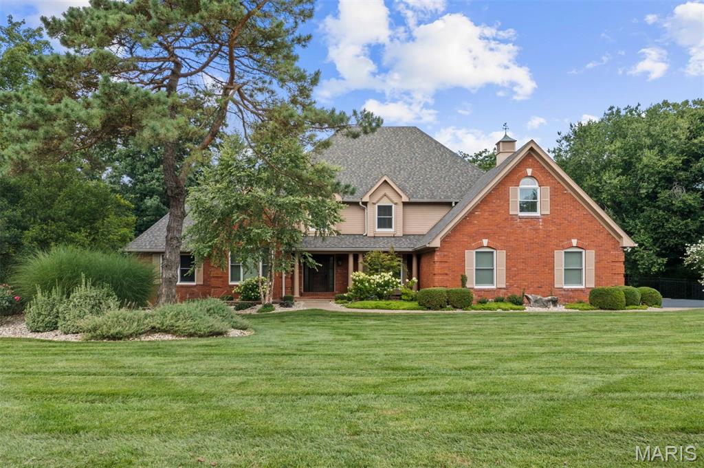 Welcome to this exquisitely renovated home in the heart of Town & Country, where every detail has been thoughtfully designed and no expense has been spared. From the moment you step into the dramatic two-story foyer with gleaming oak hardwood floors, you'll appreciate the exceptional craftsmanship and timeless elegance found throughout. The stunning two-story great room features soaring beamed cathedral ceilings and a floor-to-ceiling brick fireplace with gas logs, creating a warm yet impressive gathering space. Just beyond, the chef's kitchen is designed for both everyday living and entertaining, offering a large center island, quartz countertops with a full-height backsplash, premium stainless steel appliances, and an adjoining breakfast room. Both the kitchen and great room open seamlessly to an expansive composite deck with a retractable awning overlooking the resort-style backyard. The luxurious main-floor primary suite is a private retreat featuring a spa-inspired bathroom with heated floors, dual vanities, a freestanding soaking tub, and an oversized walk-in shower with dual shower heads. A custom walk-in closet provides exceptional storage, while direct access to the adjoining office with custom built-ins creates the perfect work-from-home space. A spacious laundry room with abundant storage and an updated powder room complete the main level. Upstairs, you'll find three generously sized bedrooms, each with custom walk-in closets. One bedroom offers a private en-suite bath, while the remaining two share a beautifully appointed Jack-and-Jill bathroom. A large bonus room provides endless flexibility as a playroom, fitness room, media space, or hobby room. The fully finished lower level expands the home's exceptional living space with a kitchenette, media room featuring a fireplace, game room, exercise room, full bathroom, and a secure vault. The backyard is truly a showpiece, designed for year-round entertaining with a spectacular pool, fully equipped outdoor kitchen, gazebo, fire pit, integrated speaker system, and extensive professional landscape lighting.
Additional highlights include an oversized three-car garage with epoxy floors, expansive walk-up attic storage, newer Pella windows and doors throughout, a whole-house generator, three-zone HVAC, three water heaters, a four-year-old roof, and a brand-new asphalt driveway.
Offering an unmatched combination of luxury, comfort, and thoughtful updates, this extraordinary home is completely move-in ready and truly one of a kind.