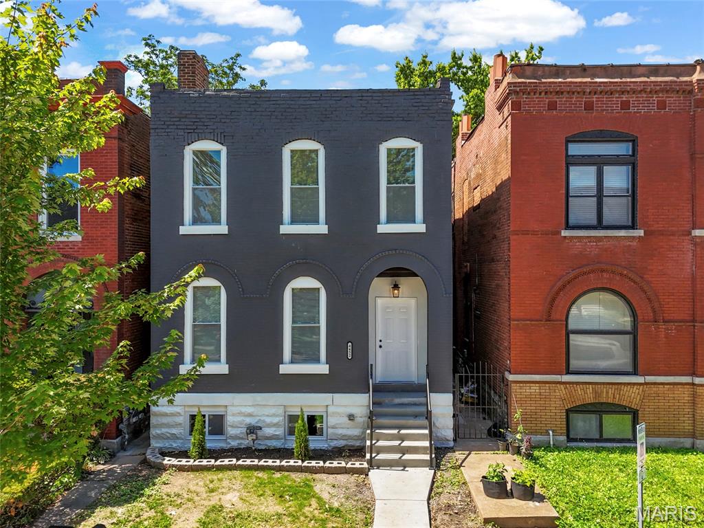 Step into the perfect blend of historic charm and modern living in this fully remodeled home, ideally located Forest Park Southeast within walking distance of The Grove - think Fidlehead Fern for morning coffee or Hello Juice & Smoothie for a morning healthy treat and Urban Chestnut for Happy Hour. Enjoy the convenience of being bike-able to the the BJC/WashU Medical Campus as well as Forest Park. 

Thoughtfully redesigned for today’s lifestyle, the main level features an open and inviting floor plan with a spacious living room, cozy den, beautifully updated kitchen which is open to the dining area and flow seamlessly together. A full bath on the main floor adds convenience for guests and everyday living.

Upstairs, you’ll find four bedrooms, including a stunning primary suite complete with a private en-suite bath and its own balcony—an ideal retreat for morning coffee or evening relaxation. An additional full hall bath serves the remaining bedrooms. Throughout the home, stylish tile selections and high-quality finishes create a sophisticated yet welcoming atmosphere.

Outside, the newly built California garage provides two dedicated parking spaces, a rare city convenience. The fully fenced yard is perfect for keeping pets or kids secure. Peace of mind is provided with a new roof, new hot water heater, new furnace, and new AC. Combining the character of a historic home with modern updates and a warm, cozy feel, this move-in-ready property offers the best of city living in one of St. Louis’ most sought-after neighborhoods.