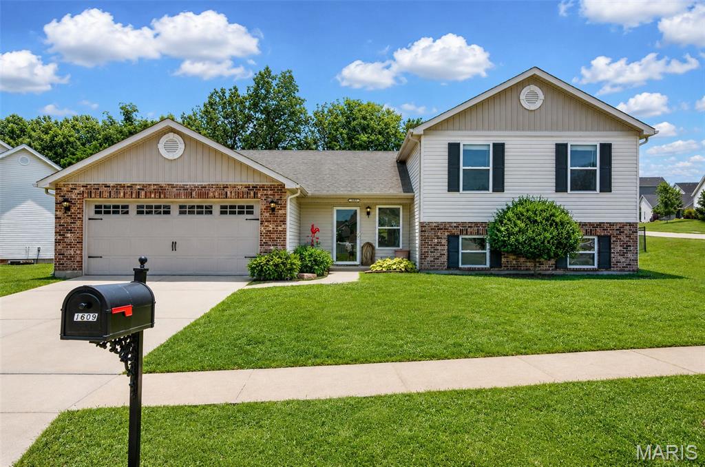 Welcome to Hannah Ridge Estates; A premier subdivision in a sought after area of Wentzville close to Wentzville Splash Station and Aquatic Center! This 3 bedroom 2.5 bath multi-level home sits on over 1/3 of an ACRE with a HUGE completely fenced in back yard lined with mature trees. You're welcomed into a spacious entry foyer featuring an open concept floor plan, vaulted ceiling, and laminate flooring throughout. Expansive living room with enough room for a large sectional and a spacious eat-in kitchen has TONS of cabinet and storage space. You'll love this floor plan! From the main floor enjoy a fully finished lower level that is visible from the kitchen/living room. Perfect for additional rec room, tv/game room, toy room, office, or gym with an additional 1/2 bathroom. Lower level also included additional storage and laundry. Just a couple steps up from the main floor you'll find a sprawling primary suite featuring walk-in closet, dual vanity, and walk-in closet. 2 additional spacious bedrooms and full bathroom complete the upper level. Seller is offering a $6,500 closing cost credit for carpet and some paint! Don't let this one slip away! Schedule your private showing today!