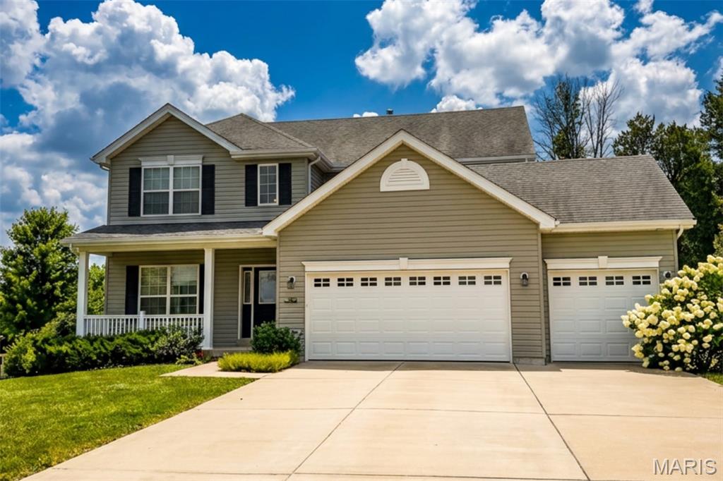 This two story home sits on a quiet cul-de-sac in Winding Bluffs—and from the moment you walk in, it feels brand new. The main level makes an immediate impression with luxury vinyl plank flooring, chic lighting on smart switches, and a wide-open layout that seamlessly connects the kitchen, dining, and family room for modern living. The kitchen serves as the heart of the home, anchored by a large island, crisp white craftsman cabinetry, slate appliances, and a gas oven designed for real cooking. In the family room, a marble gas fireplace and a sunny bay window pull beautiful natural light deep into the space. Upstairs, the primary suite is a true retreat featuring a jetted tub, separate shower, and custom closet organizers that maximize every inch. Three additional bedrooms offer the exact space and flexibility a growing household needs. The full, unfinished lower level represents a massive opportunity to build equity, boasting a 9-foot pour and a bath rough-in already in place for your future expansion. Outside, a low-maintenance composite deck—thoughtfully engineered for a future covered porch—overlooks a pristine, vinyl-fenced yard backed by evergreen trees for year-round privacy. Complete with a spacious three-car garage, this home is situated in the sought-after Fox C-6 district with Guffey Elementary located right inside the neighborhood.