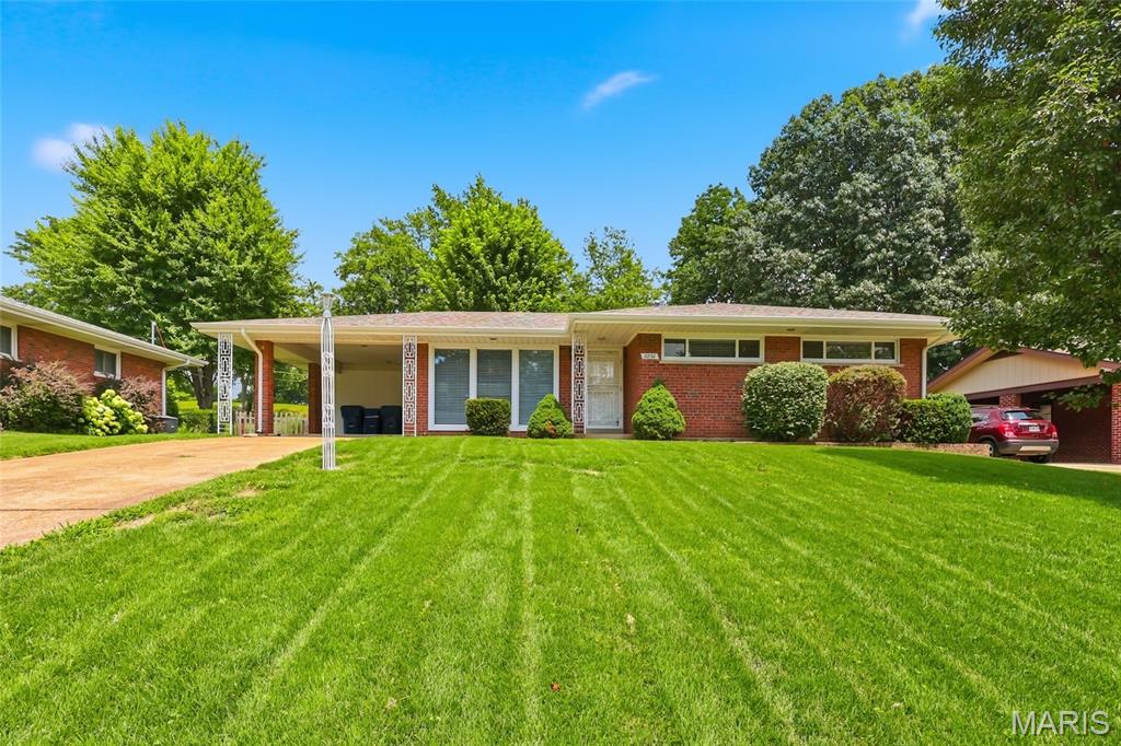 Don't miss this charming ranch home in the heart of Lindbergh School District with more than 2,000 square feet of total finished living! This beautifully maintained 3-bedroom, 1.5-bath ranch offers the perfect blend of comfort and entertaining. Gleaming hardwood floors, large picture windows, and abundant natural light create a warm and inviting atmosphere throughout the main level. The home features a spacious formal living room and dining room, along with a modern eat-in kitchen ideal for everyday living. The primary bedroom includes a convenient private half bath, while two additional bedrooms and a full hall bath complete the main floor. Step out from the dining room onto a spacious patio overlooking the well-appointed backyard—perfect for relaxing, gardening, or hosting family and friends. The finished lower level provides exceptional additional living space, including a recreation room, family room, dedicated home office space, and a versatile bonus room that can serve as guest sleeping quarters. A half bath, laundry area, and utility room add even more convenience and functionality. This wonderful home offers space, character, award-winning schools and an unbeatable location. Your new home and memories await!