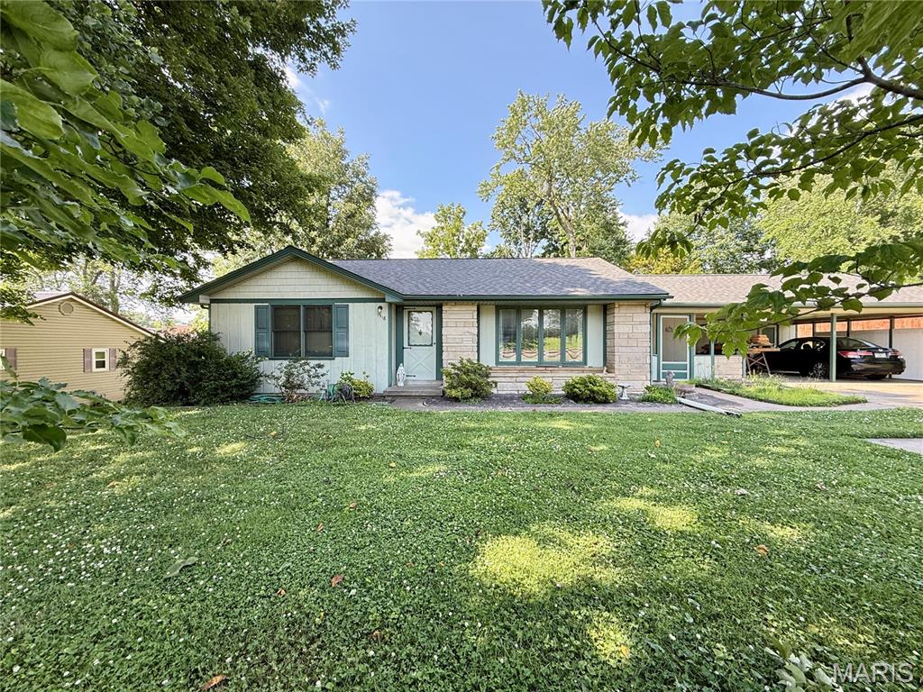 Location and a large lot! Solid 1960's built 3 bedroom home offers a large floor plan with separated bedrooms and a large main floor bathroom. Spacious front yard. The backyard offers large shade trees, established landscaping, and it even backs up to the junior high soccer field. Inside you will find newer laminate floors, solid core wood doors, and a large kitchen with wood cabinetry. Large main floor bathroom with double vanity. The kitchen and dining space are perfect for entertaining and connect directly to the back patio for BBQs. This driveway can hold at least 6 vehicles and leads up to the attached double carport. The breezeway from the carport to the house is a nice bonus. New Roof in 2025. The basement is unfinished and offers an additional bathroom space with a shower ready for a remodel. Come over and add your personal touch.