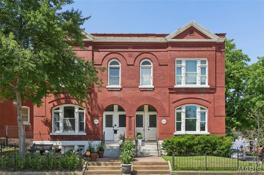 WELCOME HOME!! This stately brick townhome offering more than 2800 square feet of gracious living across two expansive floors, supported by all new systems completed within the past year. Generously scaled rooms, tall ceilings, and classic architectural details create a sense of presence from the moment you step inside. 
The main level features a sun-filled front living room with a fireplace and oversized windows. From there, the home flows into
l the family room, dining room, and updated kitchen-an ideal layout for entertaining or everyday living. The kitchen includes new stainless appliances, ample counter space, and excellent connectivity to the main living areas. 
Upstairs, the large primary suite includes an en-suite bath and a walk-in closet. Two additional bedrooms, a second full bath, and an upstairs laundry room complete the upper level. 
Out back enjoy a private outdoor entertaining area and a two-car detached garage.
Recent improvements include all new systems, freshly painted walls and ceilings, beautifully maintained plasterwork, some new windows, and thoughtful updates throughout. 
Located near restaurants, parks and the charm of Fox Park, this home blends character with modern comfort.