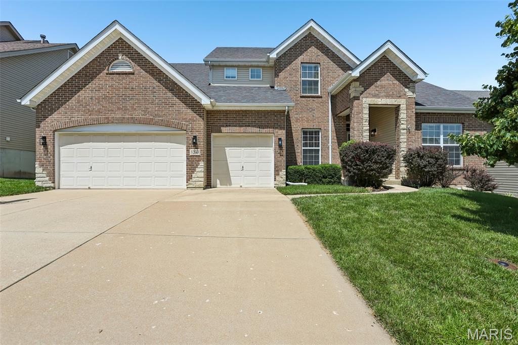Welcome to this stunning 1.5-story home in the highly desirable Mirasol community! From the full brick front, covered porch, and low-maintenance landscaping to the oversized 3-car garage, this home offers exceptional curb appeal.
Step inside to soaring ceilings, gleaming hardwood floors, and abundant natural light. The inviting foyer is flanked by a private home office with glass French doors and an elegant formal dining room featuring crown molding and chair rail detailing. The impressive two-story great room showcases a dramatic wall of windows, built-in shelving, and a cozy gas fireplace.
The gourmet kitchen is beautifully appointed with granite countertops, stainless steel appliances, 42-inch cabinetry, a breakfast bar, and a spacious breakfast room. The main-level primary suite provides a relaxing retreat with a dual vanity, corner soaking tub, separate glass-enclosed shower, and a generous walk-in closet.
Upstairs, you’ll find a versatile loft, three additional bedrooms, and a full bath. The lower level includes a bathroom rough-in and is ready for your finishing touches, offering endless possibilities for additional living space.
Enjoy outdoor entertaining on the composite deck overlooking the patio and fully fenced backyard. Additional highlights include a new upper-level HVAC system, an oversized 3-car garage, and outstanding community amenities, including a pool and tennis courts located just across the street. All of this is served by the highly acclaimed Rockwood School District while benefiting from Jefferson County taxes!