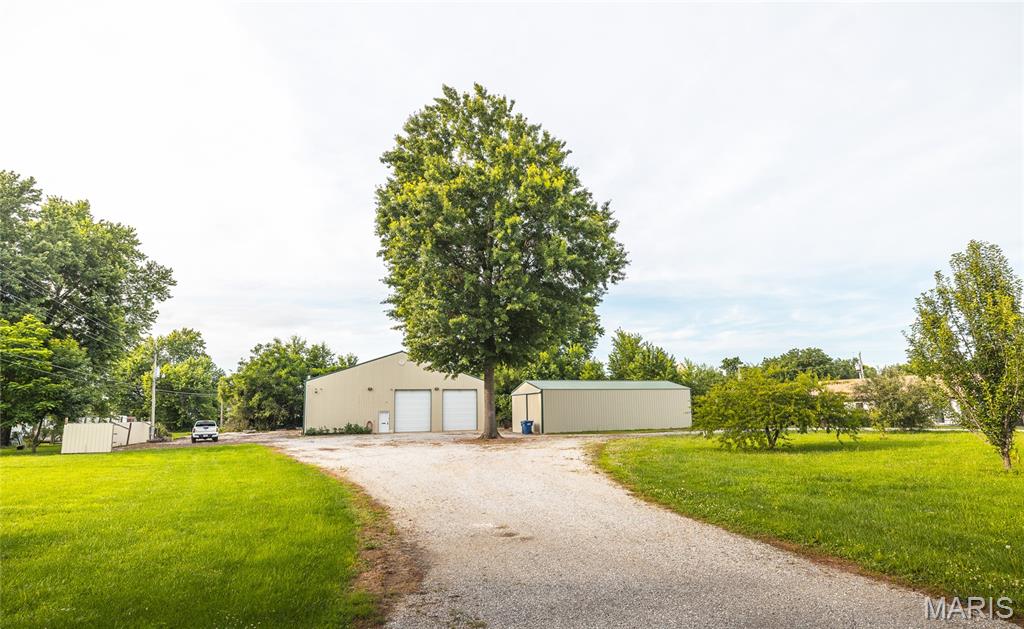 Opportunity meets versatility in the heart of Licking, Missouri! Situated on a little over 1 acre, this impressive property offers a rare combination of residential comfort, workshop space, storage, and income-producing potential. Whether you're a business owner, hobbyist, investor, or someone looking for room to spread out, this property is packed with possibilities. The centerpiece is a substantial 60x60 Butler building featuring concrete floors, power doors, a storm shelter, RV hookups/cleanout, and a comfortable 1-bedroom, 1-bath apartment. The apartment provides a convenient place to live on-site, host guests, or create rental income, while additional storage space above offers even more flexibility. Security equipment will remain with the property, providing added value for the next owner. A second 23x48 Butler building with electric service and sliding doors expands the property's functionality, making it ideal for equipment storage, workshop space, vehicles, or future business use. The open acreage provides easy access and maneuverability while maintaining a manageable footprint. Located within the city limits of Licking, you'll enjoy the convenience of nearby shopping, dining, and services while still having the space needed for projects, recreation, or business operations. Properties offering this level of versatility, infrastructure, and potential are hard to find. Don't miss your chance to own this unique property with endless possibilities. Schedule your private showing today and see everything it has to offer!