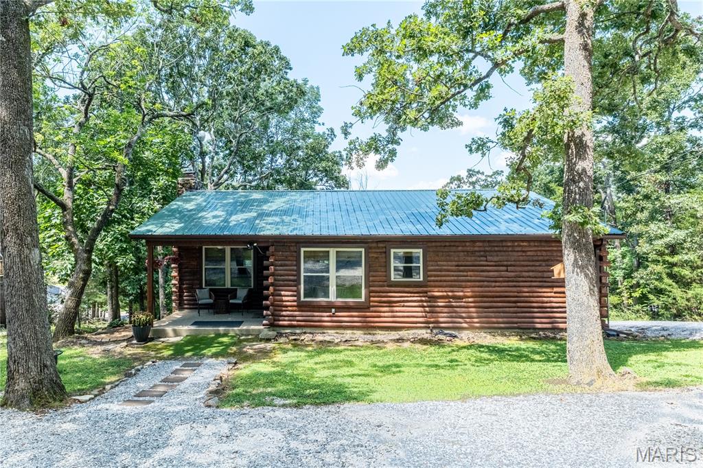 Nestled among the trees at beautiful Lake Perry, this charming 3-bedroom, 1.5-bath cabin is a true gem. Completely updated within the last two years, this eye-catching home showcases the care and attention the current owners have invested since purchasing the property.
Step inside and you'll immediately appreciate the modern finishes and inviting atmosphere. Everything has been updated, including gorgeous granite countertops and stainless steel appliances. The accessible crawlspace provides excellent additional storage, a rare and practical feature. There is a water view from the top deck.
Enjoy everything Lake Perry has to offer, including a 200-acre (more or less) spring-fed lake, a community in-ground pool, sandy beaches, playgrounds, pavilions, a seasonal restaurant, and much more. This home is conveniently located within walking distance of the community swimming pool, making it easy to enjoy the amenities.
For added comfort and energy efficiency, the entire home—including the attic and crawlspace—has been insulated with conditioned spray foam. The washer and dryer are also included, making this move-in-ready cabin an exceptional opportunity to enjoy lake living at its finest.