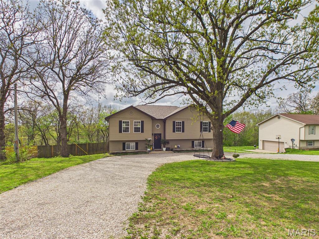 Welcome to 21819 Laramie Rd, a beautifully updated 4-bedroom, 3-bathroom home offering comfort, space, and modern living in one of St. Robert’s most convenient locations. Step inside to an inviting open floor plan filled with natural light, updated bathrooms, and a kitchen designed to impress with granite countertops and custom cabinetry. The home features a huge second family room on the lower level, perfect for movie nights, play space, or hosting guests. Outside, enjoy peaceful evenings and stunning sunsets from your back porch, overlooking the large fenced-in backyard—ideal for pets, gatherings, and outdoor fun. Practical updates include a new roof (2022) and new water heater (2025), plus an oversized garage offering tons of built-in storage shelving. Located just 5 minutes from East Elementary, 8 minutes from Walmart, and 10 minutes from the main gate, this home blends comfort, convenience, and charm in every direction. A rare find with room to grow and spaces to love. You don't want to miss this one! Schedule your private viewing today!