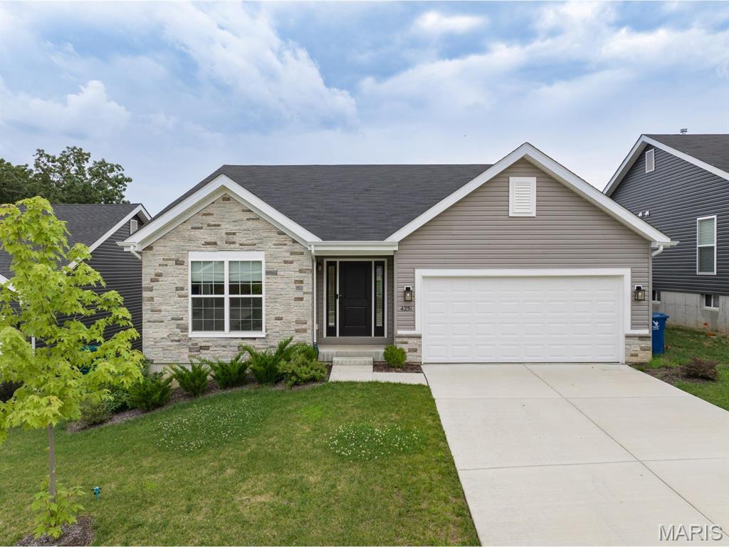 Welcome to your brand-new, move-in-ready dream home located at 4251 Bear Ridge Drive, House Springs, Missouri 63051! This spectacular 3-bedroom, 2-bathroom single-level ranch features the highly desirable Aspen II floorplan by McBride Homes. It avoids the typical wait times of building from scratch, offering a pristine, turn-key residence ready for occupancy this winter.Elegant Living SpacesStep through the front door into an expansive, light-filled open concept layout. Dramatic vaulted ceilings stretch over the main living areas, which are complemented by upgraded 6-foot windows and beautiful, durable premium wood laminate flooring.Gourmet Chef's KitchenThe heart of the home is a designer kitchen curated with high-end finishes, perfect for daily living and entertaining:Massive Center Island: Features an integrated breakfast bar for casual dining.Premium Cabinetry: Upgraded 42-inch Benton Sarsaparilla cabinets provide sophisticated, rich dark tones.High-End Surfaces: Stunning quartz countertops paired with a generous walk-in pantry.Modern Appliances: Fully equipped with sleek, stainless steel GE appliances.Private Master Suite RetreatTucked away for ultimate privacy, the luxurious master suite is a peaceful sanctuary:Bright and airy ambience powered by an oversized display window.Double the storage capacity with spacious dual closets.En-suite bathroom equipped with double sinks and a contemporary walk-in shower.Outdoor & Lower Level PotentialThe dining area includes a large sliding glass door that transitions smoothly to a covered future deck area, which comes pre-wired for a ceiling fan. Downstairs, the expansive, unfinished lower level offers a 3/4 bathroom plumbing rough-in, allowing you to build equity by easily adding a basement bathroom, extra bedroom, or recreation area down the road.Premium Agent-Added ExtrasThis home is packed with high-value upgrades that go far beyond standard base-model builders:Upgraded Fixtures: Designer lighting and plumbing hardware throughout the home.Architectural Details: Modern 2-panel interior doors and an extended 2-car garage.Curb Appeal: Beautiful exterior coachlights that accent the front facade.Peace of Mind: Full main-floor laundry room for ultimate convenience.The NeighborhoodSituated in the scenic Manors at Bear Ridge community, this property combines quiet, park-like surroundings with exceptional convenience. Residents enjoy beautiful rolling views, nearby walking trails, and quick access to Rockford Beach Park and Don Robinson State Park. It is also served by the highly regarded Northwest School District.Skip the design meetings, avoid inflation price hikes, and step right into a fully personalized, upscale home without the stress of construction.