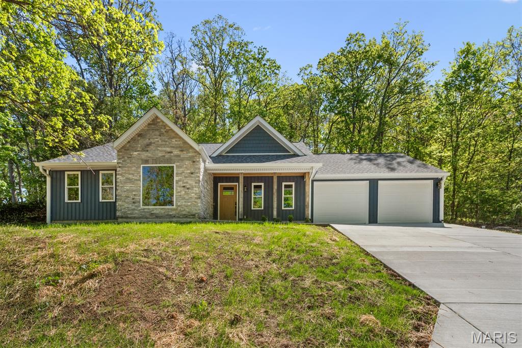 Beautiful newly constructed home with 3 bedrooms and 2 full bathrooms ready for you to call home! You are first welcomed with a large covered front porch that leads you into an open floorplan highlighting neutral tones throughout with a huge living room area featuring a vaulted ceiling, gas fireplace with tv installed and tons of natural light from the surrounding windows. Kitchen is complete with custom white soft close cabinets, breakfast bar, stainless steel appliances, tiled backsplash and quartz countertops. Just off the kitchen is a nicely sized dining area with a door leading to the backyard. A convenient laundry/mud room connects to the garage. Master bedroom offers a large walk-in closet and a master bathroom beautifully done with a double sink vanity, gold hardware and accents, soaking tub, separate step-in shower and heated flooring. There are 2 additional sizable bedrooms with walk-in closets and an additional full bathroom with an oversized vanity and shower/tub combo. Don’t forget to check out the immaculately finished oversized 2 car attached garage with an epoxy floor, power washer and shop vac installed. Some additional exceptional features include a full house sound system, security system for added comfort and a central vac system making this home even more desirable. Home is on a slab and includes public utilities. Do not hesitate in making your appointment to come check out this beautiful new home today!