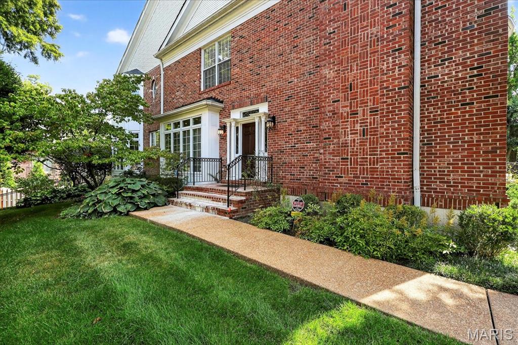 BACK ON THE MARKET--Truly no fault of Seller. This newly enhanced and reimagined residence on one of Clayton’s most coveted streets presents an exceptional opportunity. Thoughtful updates now emphasize a more intuitive and contemporary flow centered around the open concept kitchen and hearth room, creating effortless modern living. A rare private side front entry gives the feeling of a single family home. Inside, natural light, hardwood floors, and refined architectural details elevate the first floor. The chef’s kitchen features high end appliances, granite counters, and a large center island and opens seamlessly to the hearth room with fireplace and an elegant dining area. Upstairs, the serene primary suite offers treetop views, a custom walk in closet, and a spacious bath with dual vanities, separate tub, and shower. Two additional bedrooms share a well appointed hall bath with laundry conveniently nearby. The finished lower level with full bath provides flexible space for guests, fitness, or a home office. Outdoors, two expansive decks extend the living and entertaining options, while the oversized two car garage adds exceptional convenience. With its walk to everything location and refined layout, this home blends luxury, privacy, and lifestyle in the heart of Clayton.