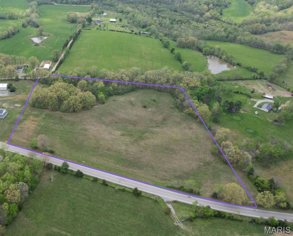 14.33 beautiful acres with over 500ft of highway frontage and access from the county road 372 behind property.  (Includes newly obtained Modot permit for driveway on Hwy 72.) Mostly cleared land with electric available and a plethora of agricultural, residential, or commercial possibilities.  Situated in between Millersville and Patton.