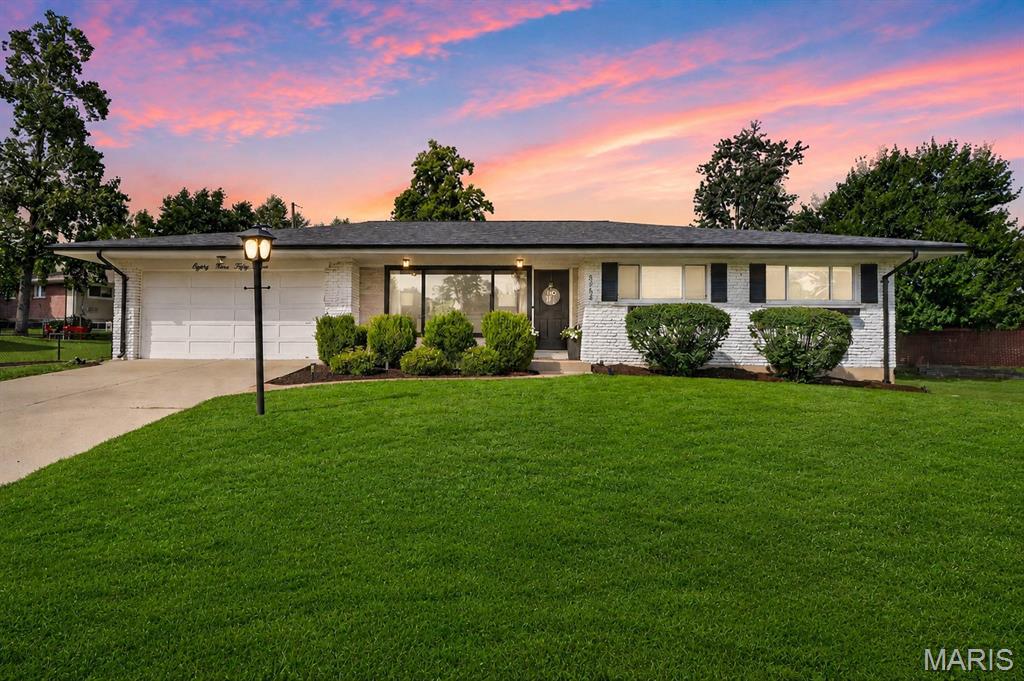 Welcome to the home you’ve been waiting for in the award winning Lindbergh School District! This stunning mid-century built, all-brick ranch home at 8954 Westhaven Ct. boasts exceptional curb appeal, featuring fresh landscaping and on an expansive corner lot. Upon entering, you’ll be greeted by beautiful hardwood floors and a large picture window that floods the living room with natural light. The dining room is conveniently located right next to the kitchen for easy access. The kitchen offers an exceptionally clean aesthetic with brand new quartz countertops, white cabinets w/ modern hardware, and stainless steel appliances. You'll likely find yourself spending most of your time in the giant family room featuring a gas insert fireplace surrounded by built-ins, and a lovely bay window looking out into your new backyard.. Access the garage and backyard patio from the family room as well. The main floor features two generously sized guest bedrooms, a full hall bathroom, and a master bedroom with its own en-suite bathroom.. Venturing downstairs, you’ll be thrilled to discover a beautifully finished lower level that enhances your living space. Storage, laundry room, and a half bathroom also in lower level. New carpet throughout all bedrooms and lower level! The backyard is perfect for entertaining or family summer nights! Schedule your showing before it's too late!