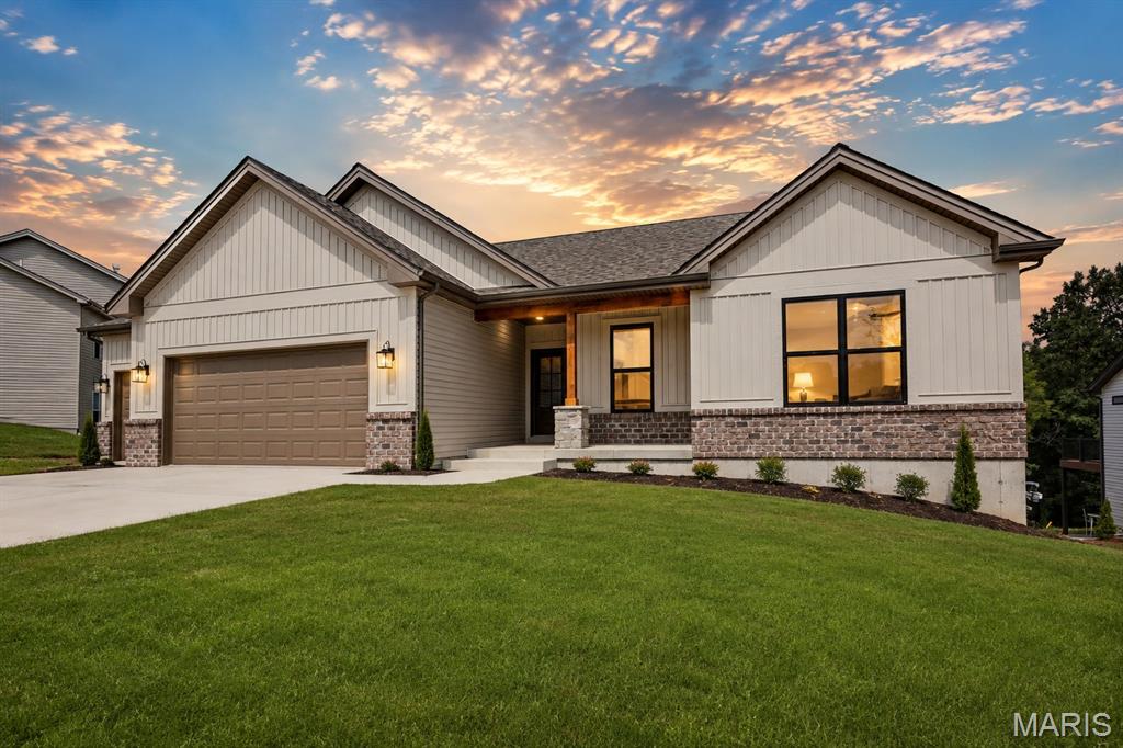 **READY NOW** If you’ve been searching for a home with a private backyard, beautiful scenery, and walkability to parks, trails, and shopping, this one is for you.
The open-concept floor plan features high ceilings, modern finishes, abundant natural light, and a seamless flow between the kitchen, dining, and living areas, perfect for gatherings or cozy nights in. The kitchen is beautifully appointed with quartz countertops, a large center island for gathering, stylish cabinetry, stainless appliances, and on-trend lighting. Durable flooring, neutral designer paint colors, and thoughtful details throughout make this home move-in ready.
The primary suite offers a private escape with a spacious layout, walk-in closet, and well-designed bath. Additional bedrooms provide flexibility for guests, a home office, or growing families.
Location truly sets this home apart. Enjoy being close to shopping, dining, and everyday conveniences while also being walkable to nearby parks and scenic trails. Live where you can step outside and instantly connect with nature, without sacrificing accessibility.
Homes with wooded backyards, scenic views, and this level of finish in Washington don’t last long. Schedule your private showing today and experience the lifestyle this property offers.  Options in this new inventory home include: Three car garage + 2' added for depth.  Luxury kitchen with upgraded "coastline" cabinets, quartz countertops, 42" cabinets, pull out pantry, large island with plenty of seating and upgraded appliance package.  10' ceilings in common area, 9' throughout, and a 9' basement pour. Covered back deck and large patio all included on this premium homesite at Stone Bridge.

Front elevation will showcase brick to sill height with stone column base. Warm tones with 6x6 Cedar post with 6x8 cedar beam at front porch for added detail. Double gable over the front porch. Vertical board and batten front facing siding in sand color with toasted almond accents and black windows.

 Whether you’re entertaining on the patio or simply enjoying quiet evenings outdoors, the wooded backdrop creates a true retreat feel while still being minutes from everything Washington has to offer.

 This new development boasts large homesites, fantastic views and treelined backyards.  Northern Star has been building Homes in Washington Missouri for over 25 years. Your foundation, framing, electrical, plumbing, roofer and finish carpentry are made up of local skilled tradesman who take pride in their work and in their hometown.

Northern Star Homes - your hometown builder.