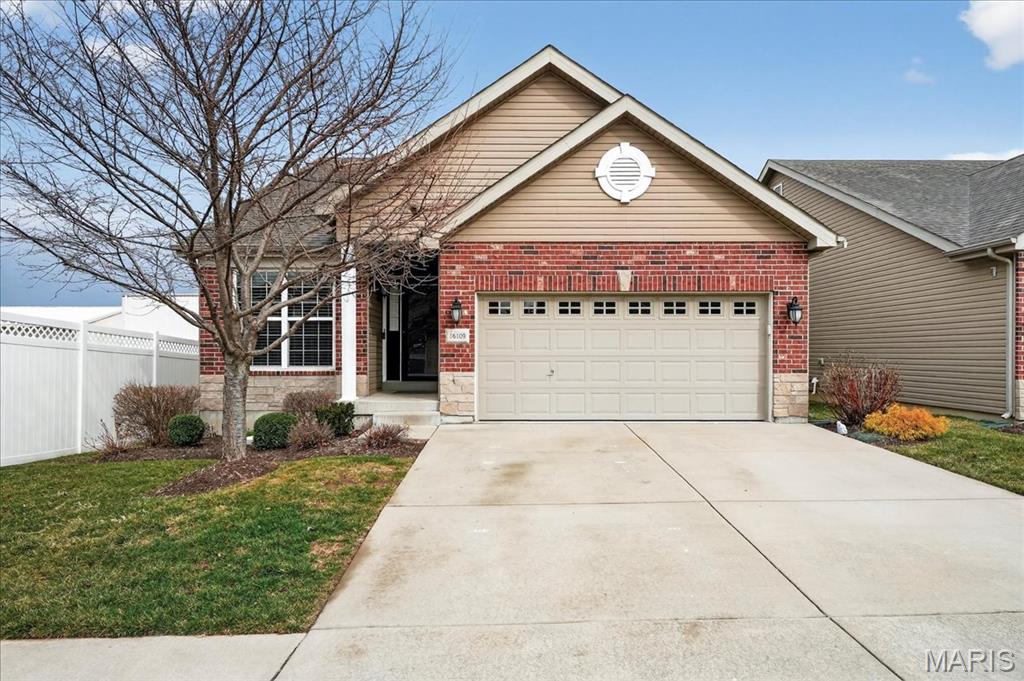 Skip the shared walls—this rare detached ranch villa in Ellisville delivers privacy, space, and a finished lower level in Rockwood Schools. Unlike most homes in the subdivision, this villa is not attached, offering the feel of a single-family home with the convenience of low-maintenance villa living. Inside, the main level features a bright, open layout with neutral paint colors, engineered wood flooring, and a welcoming living room highlighted by a gas fireplace, vaulted ceilings, and a ceiling fan. The kitchen offers espresso-colored cabinetry, stainless steel appliances, and a large angled center island with bar-height seating—ideal for casual meals or entertaining. Just off the breakfast area, a small deck with steps down to the grass provides easy outdoor access. The main floor includes two bedrooms and two full bathrooms, including a spacious primary suite with vaulted ceilings, a rear-facing bay window, and an en-suite bath with dual sinks and a shower-only layout. A standout feature is the laundry room located just off the garage, complete with built-in cabinetry, countertop space, a sink, and stacked washer and dryer. The two-car garage features an epoxy-coated floor, adding durability and a polished finish. The finished lower level adds approximately 600 sq ft of additional living space, including a large family or rec room, a third bedroom, and a third full bathroom. With drywalled ceilings and recessed lighting, the lower level feels bright and finished, while still offering ample unfinished storage space. With 1,442 sq ft on the main level, a thoughtfully finished lower level, and the rare benefit of being a detached villa, this home offers comfort, functionality, and privacy in a highly desirable Ellisville location.