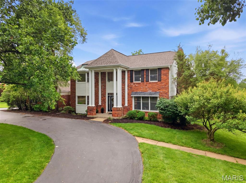 Originally designed as the display home for Kehrs Mill Estates, this beautifully maintained 4-bedroom, 3.5-bath brick home offers over 4,100 square feet of inviting living space on a picturesque 1-acre lot in Clarkson Valley.  A stately circular drive and side-entry 3-car garage complements the homes timeless architecture while the freshly updated two-story foyer welcomes you inside to rich woodwork, hardwood flooring, 9-foot ceilings, fresh paint, updated lighting, a brand-new roof and new carpeting throughout much of the home.  

Designed for both comfortable everyday living and effortless entertaining, the main level features spacious gathering areas, a large center island kitchen with granite countertops and newer gas cooktop, and multiple walkouts leading to the deck and backyard. The impressive primary suite offers vaulted ceilings, large windows overlooking the property, a spacious walk-in closet, double vanities, soaking tub, and oversized shower.

The finished walkout lower level provides exceptional additional living space with a full bath and room for recreation, media, or game areas. With mature landscaping, peaceful pond views beyond the property, and expansive outdoor space with room to create your dream backyard retreat, this home offers a rare combination of space, warmth and setting within the highly rated Rockwood School District (Marquette).