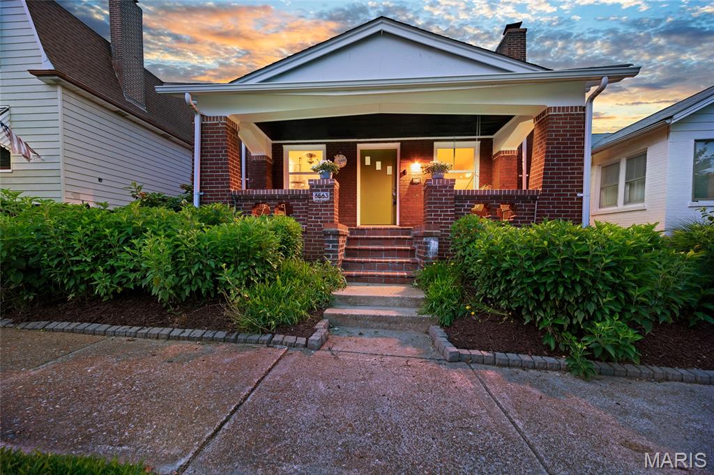 Looking for something that is the perfect mix of Adorable and Affordable? Well look no further than 6563 Hoffman Ave! Prepare to be abundantly enamored with this absolutely CHARMING full-brick 3-bedroom, 2-bath bungalow on a quiet, tree-lined street in the highly sought-after Clifton Heights neighborhood! From the inviting covered front porch to the beautiful stained glass windows and rich wood floors, this home is filled with timeless character and classic South City vibes. The spacious living room opens to a separate dining room, creating a comfortable layout for everyday living and entertaining. The eat-in kitchen offers generous cabinet and counter space while preserving its original charm. The upstairs primary suite is an absolute SHOW STOPPER!! It features a full bath with a stunning dual zone shower, separate vanities and HEATED TILE FLOORS. Don't forget to take a peek at the extra storage behind the hidden door bookcases! The primary suite also features flex room that could function well as a huge walk in closet, a work from home office, or would make a wonderful room to pursue your artistic endeavors or burn your early morning calories in your Peloton studio! Main floor boasts two spacious additional bedrooms. The zoned HVAC system here keeps ALL levels of the home comfortable year round. The main floor full bath is also well appointed and updated.  Just off the kitchen, the bright all-seasons sunroom provides the perfect space to relax, work from home, or enjoy views of the kiddos and pups bounding about in the flat fenced backyard. A detached one-car garage also offers convenient off-street parking. Enjoy all the conveniences of Clifton Heights: just moments from Clifton Heights Park, The Hill, Forest Park, The St. Louis Zoo, and amazing local restaurants (Los Arcos, Biggies, Vinnie's, LeGrands, Pizza a Go Go - to name just a few!) shopping, and easy access to Highways 44 and 40/64. Don't miss your chance to call this one HOME!