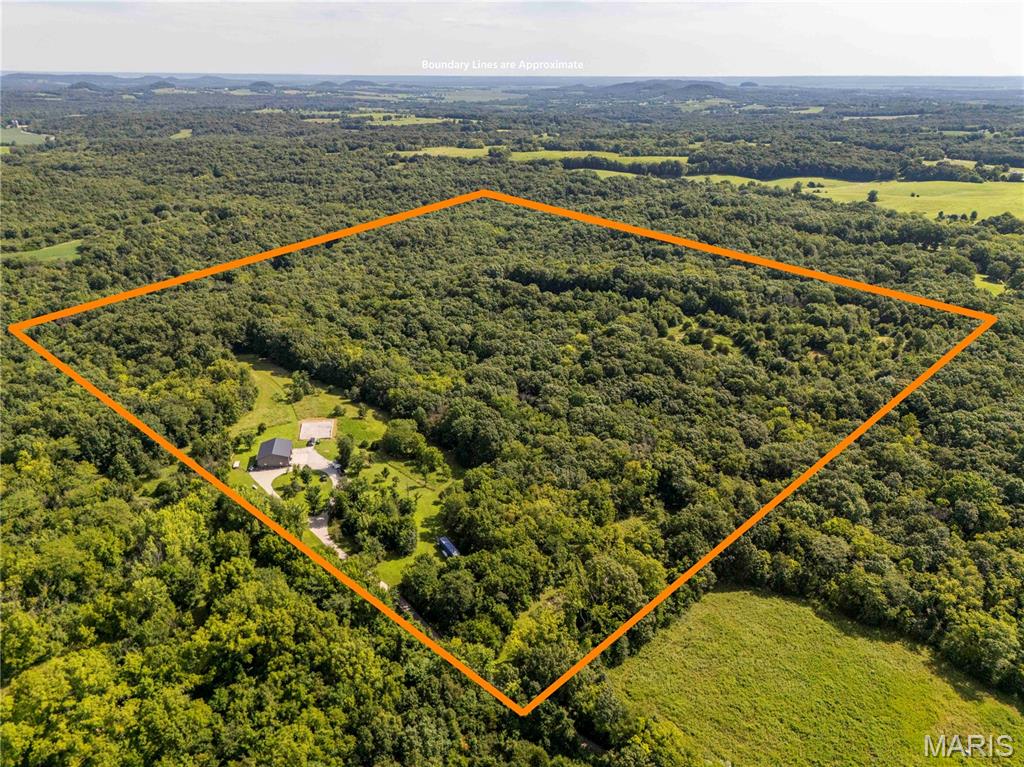 Discover the perfect turnkey hunting retreat! This 44+/- acre property features established trails and food plots. Natural spring feeds a wet-weather creek. The current owners enjoy a healthy population of white tail deer in a prime location for bedding. The spacious 50x40 shed/shouse is perfect for gear and vehicles, with a full kitchen and full bath with a tankless water heater. Enjoy pure well water with a softening system. Starlink internet, internal and external Wi-Fi, and overhead audio. The gun room keeps equipment secure, while three loft spaces provide comfortable sleeping quarters. Year-round comfort with in-floor radiant heat, a pellet stove, and central heat and AC. The 6x7 hanging deer cooler is perfect for processing your harvest. The property includes a shared road agreement and a 45x65 foundation with plumbing and water started, offering room to expand. This is the ideal blend of adventure, relaxation, and future potential—move in and enjoy! Property is down a private lane. Please do not visit the property without an appointment.