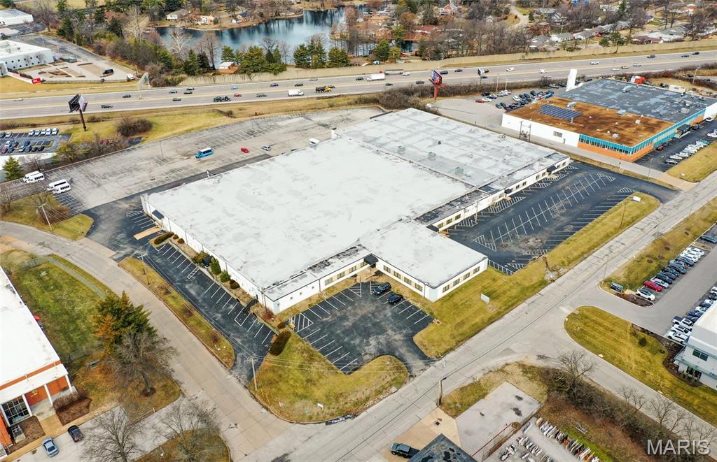 Prime 135,000 S.F Flex Office Warehouse Building Consisting of 4 Units now available for Sale.
The property was constructed in 1964 on 7.27 acres. The current configuration is ~70% office and 30% warehouse. The building has 100% a/c throughout and is fully-sprinklered with a wet system. There are (7) 8' x 9' dock doors and (1) 9' x 10' drive-in door. 45 mil TPO roof installed in 2017 with a 15 year warranty. 14' clear height in warehouse and 3-phase power with 1,200 amps / 480 volts. Over 360 parking spaces on site.
Property is centrally-located in Overland, MO with frontage on Interstate 170. Location: City