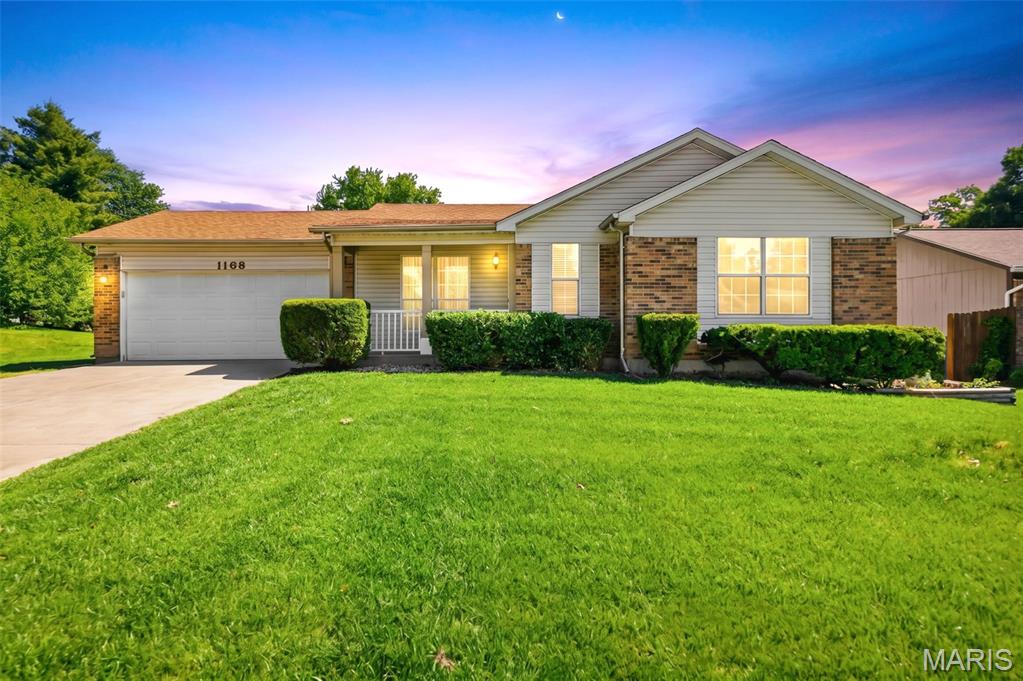 Well-maintained ranch home in the heart of St. Peters offering comfort, space, and move-in ready convenience. Step into the inviting foyer and enjoy the vaulted living room filled with warmth and natural light. The spacious primary suite is located near the front of the home and features a full bath with walk-in shower. The kitchen offers ceramic tile flooring, stainless steel appliances, abundant counter space, and white cabinetry. Two additional bedrooms with newer carpeting and a second full bath complete the main level. Sliding doors off the kitchen lead to a spacious deck overlooking the level, fenced backyard—perfect for relaxing or entertaining. The finished lower level includes a large recreation/family room with cozy gas fireplace, bonus dry bar area, office space, convenient half bath, and oversized laundry/storage room with plentiful shelving.