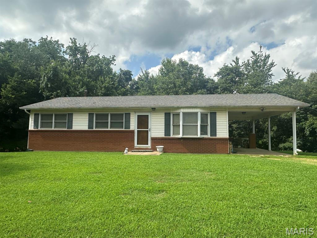 This great home offers a wonderful country feel while still being just minutes from Dexter. Set on 1.07 acres, the property provides space, privacy & room to enjoy outdoor living. You’ll appreciate the layout and potential the home already has, with many features that make it comfortable today & versatile for the future.The main floor includes a welcoming living room, perfect for relaxing with family & friends.The kitchen is designed for everyday convenience.. includes a breakfast bar & a dining space. Also equipped with a range and a dishwasher. Thermopane windows help provide insulation & comfort throughout. The main level offers three bedrooms & one full bathroom. The bathroom includes a tub, and could easily add a shower overhead if you’d like to customize the space. The home includes central heat & air using LP gas, supporting year-round comfort. Stairs lead down to the full walkout basement, which adds significant extra space & flexibility. It features a large open area measuring 960 square feet, giving you plenty of room to design & arrange it however you want…dream your dream here!
