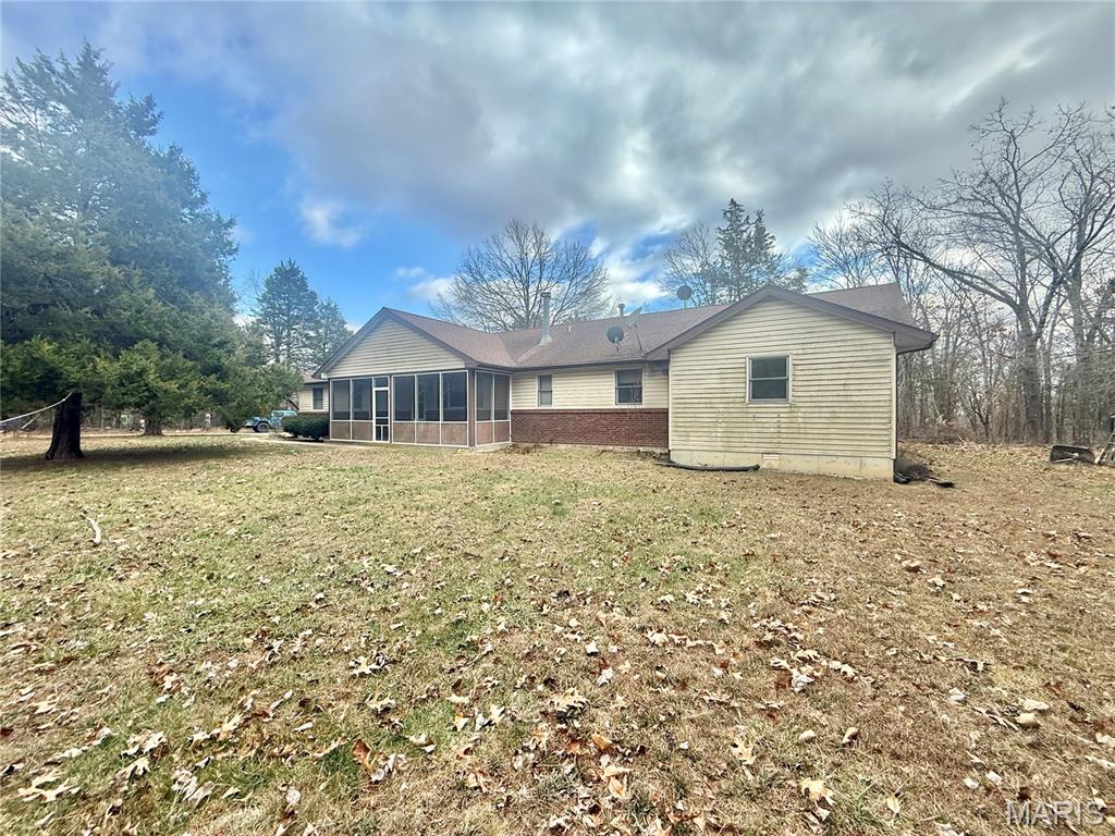 Discover exceptional comfort, functionality, and privacy in this beautiful three-bedroom, two-bathroom single-story ranch home. Set on an impressive 3.1 acres, this property offers the peace and quiet of country living while providing the modern conveniences and flexible spaces today’s homeowners value most. Its inviting layout, thoughtful upgrades, and additional detached shop make it an outstanding opportunity for first-time homebuyers or anyone seeking room to grow. An oversized attached two-car garage welcomes you home, providing abundant storage and easy access directly into the residence. Step inside to an inviting open-concept floor plan that seamlessly blends the living room, dining area, and kitchen, creating an ideal environment for both daily living and entertaining. Large windows provide natural light throughout, while the open sightlines enhance the home’s spacious, comfortable feel. The kitchen serves as the heart of the home, featuring a generous center island, extensive cabinet space, and a layout designed for both functionality and style. Whether preparing meals, hosting gatherings, or enjoying quiet mornings, this space is designed to meet the demands of modern living. All three bedrooms are conveniently located on the main floor, including a well-appointed primary suite complete with its own private bathroom. The additional bedrooms are comfortably sized and supported by a second full bathroom, making this home perfectly suited for families, guests, or flexible use as office or hobby space. Below the main level, a full unfinished basement provides exceptional potential. With its expansive footprint, it is ready to be transformed into future living space, a recreation area, storage, or anything your lifestyle may require. Outside, the acreage offers privacy, open space, and the tranquility of a rural setting. An outdoor wood-burning stove provides an excellent alternative heat source and adds to the home’s self-sufficiency and charm. The property also features an impressive detached shop, fully heated and cooled, delivering more than enough room for a business, workshop, or substantial storage needs. This versatile structure includes multiple office spaces, a bathroom, and an expansive open bay, making it ideal for professional use, creative projects, or equipment housing. With its combination of comfortable living, extensive land, and exceptional outbuildings, this property offers a rare blend of privacy, convenience, and opportunity. Thoughtfully designed and well-appointed throughout, it stands as an excellent choice for first-time homebuyers seeking a home they can grow into—both now and for years to come. Schedule your tour today!!!! More pictures coming soon.